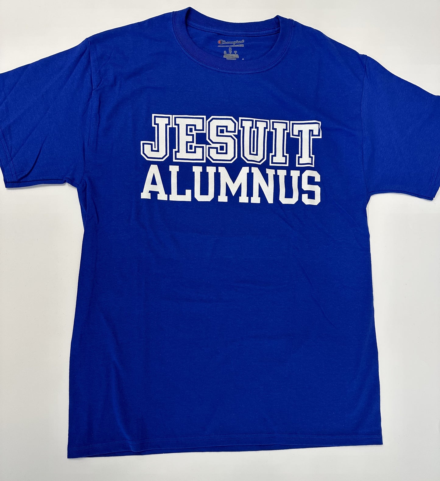 Champion. 100% Cotton Jersey. Set-in neck rib. Jesuit Alumnus logo.