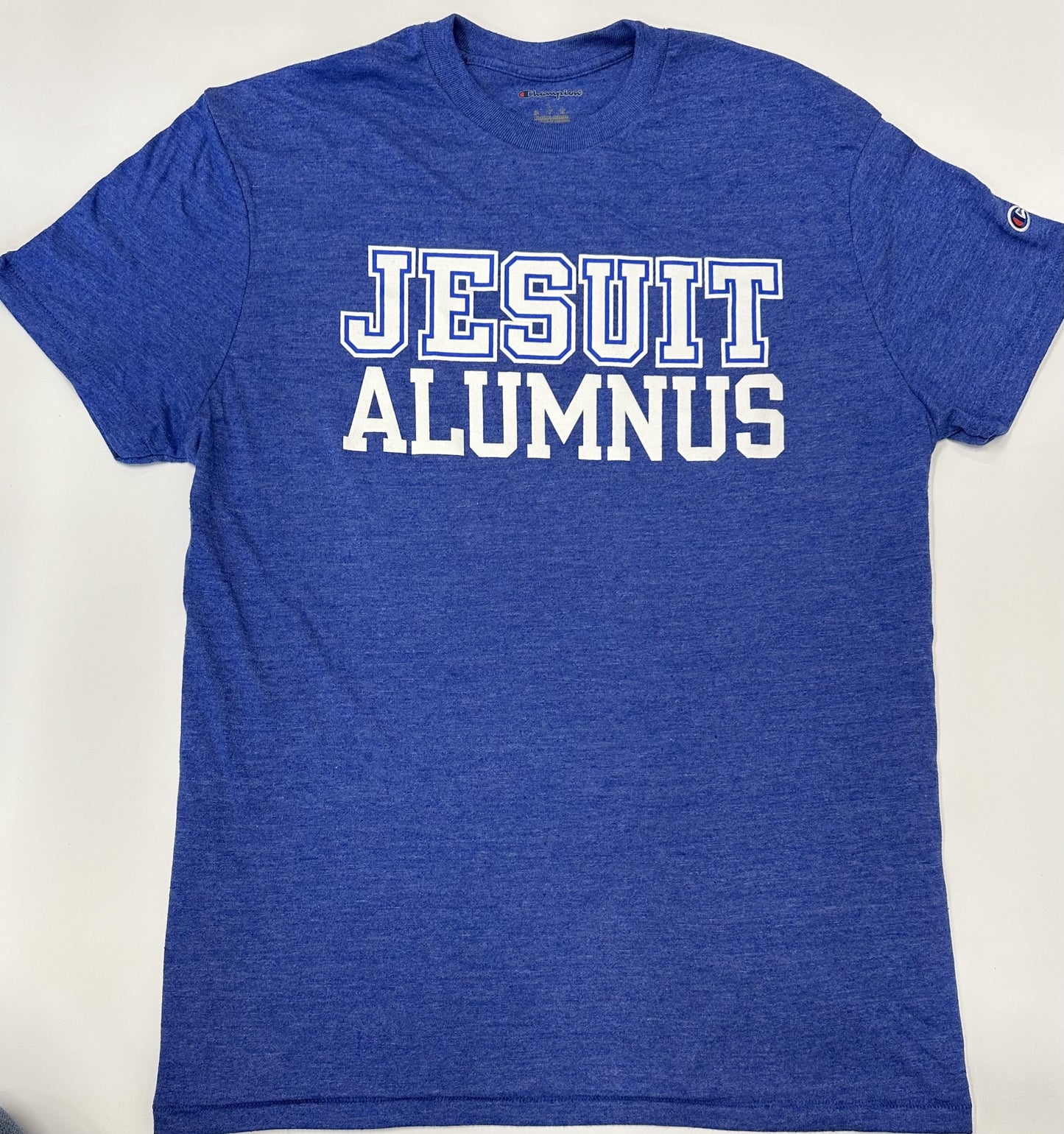 Champion. 50% Polyester/37% Cotton/13% Rayon Jersey. 1 x 1 rib at collar. Set in short sleeve with slightly shorter, more modern fit. Jesuit Alumnus logo.
*Visit the Shop at Carrollton & Banks for more styles.