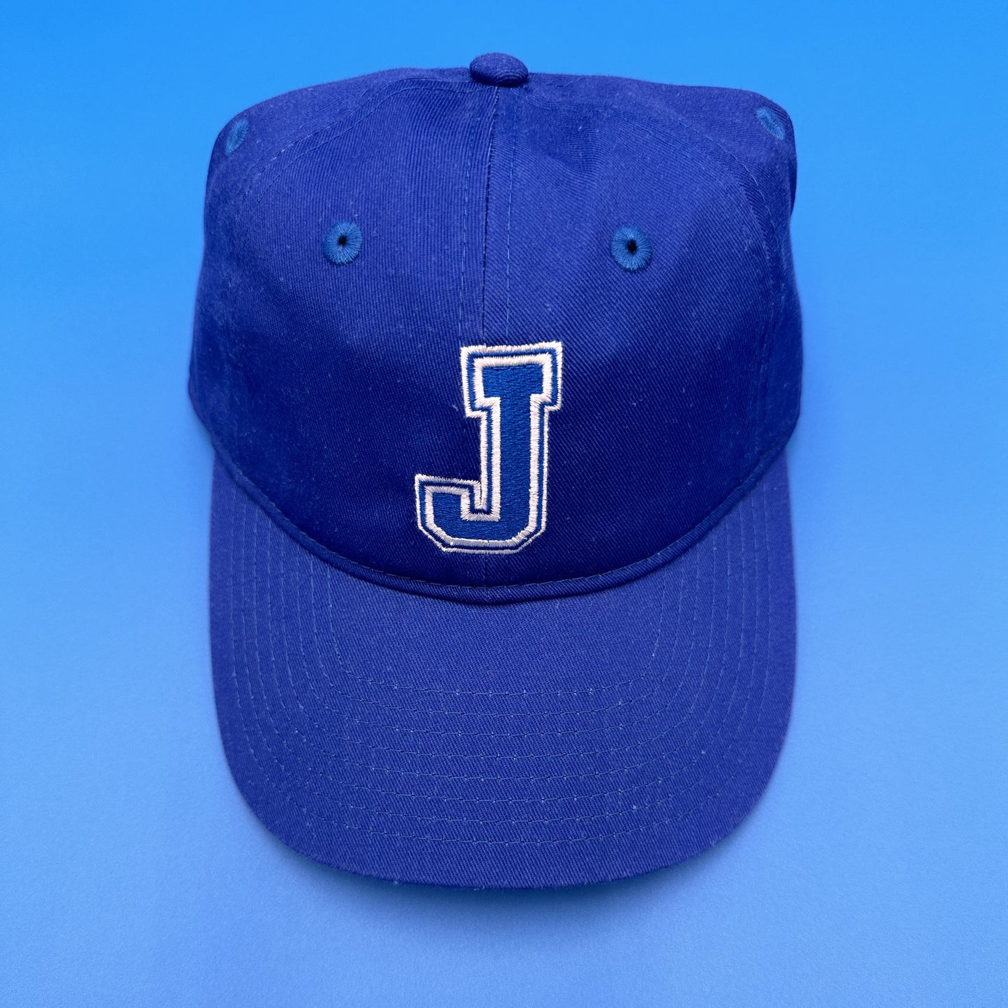 Champion. 65% Polyester/35% Cotton twill. Unstructured, low-profile fit. One Size Fits Most