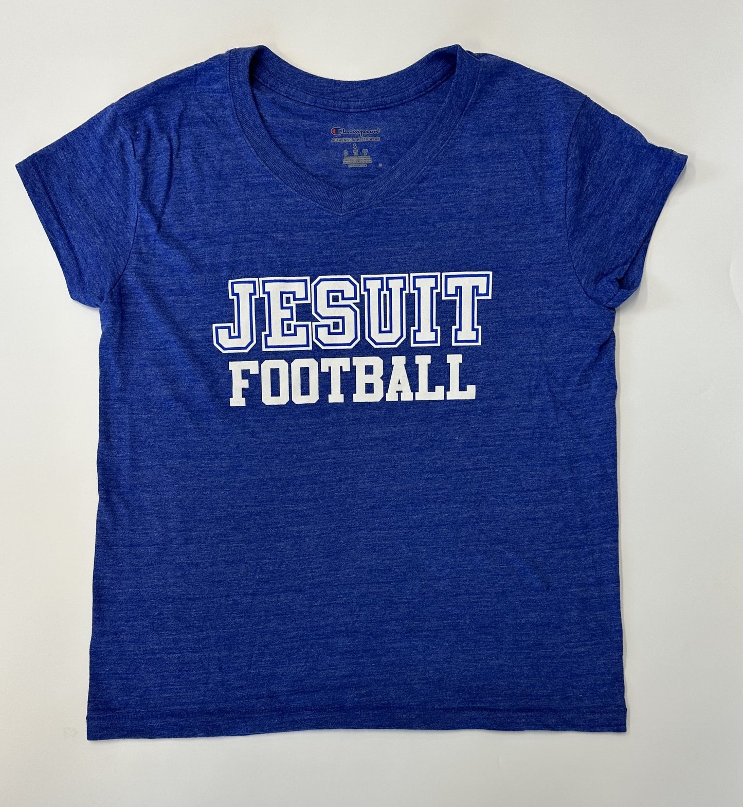 Champion. Tri-Blend: 50% Polyester/37% Cotton/13% Rayon Jersey. 1 x 1 rib at collar. Set in short sleeve & relaxed body. JESUIT FOOTBALL logo.