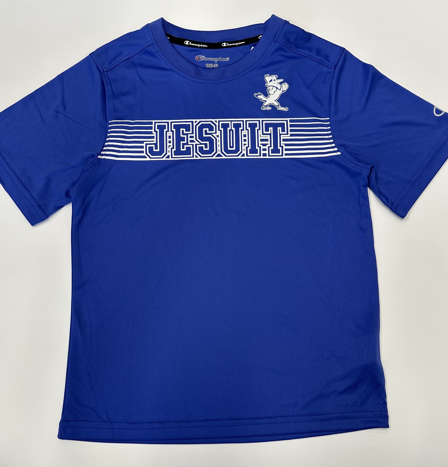 Champion. From the 2024 Stadium Collection. 100% Polyester. Self Collar. Set in sleeve construction. Screen-printed Jesuit logos.