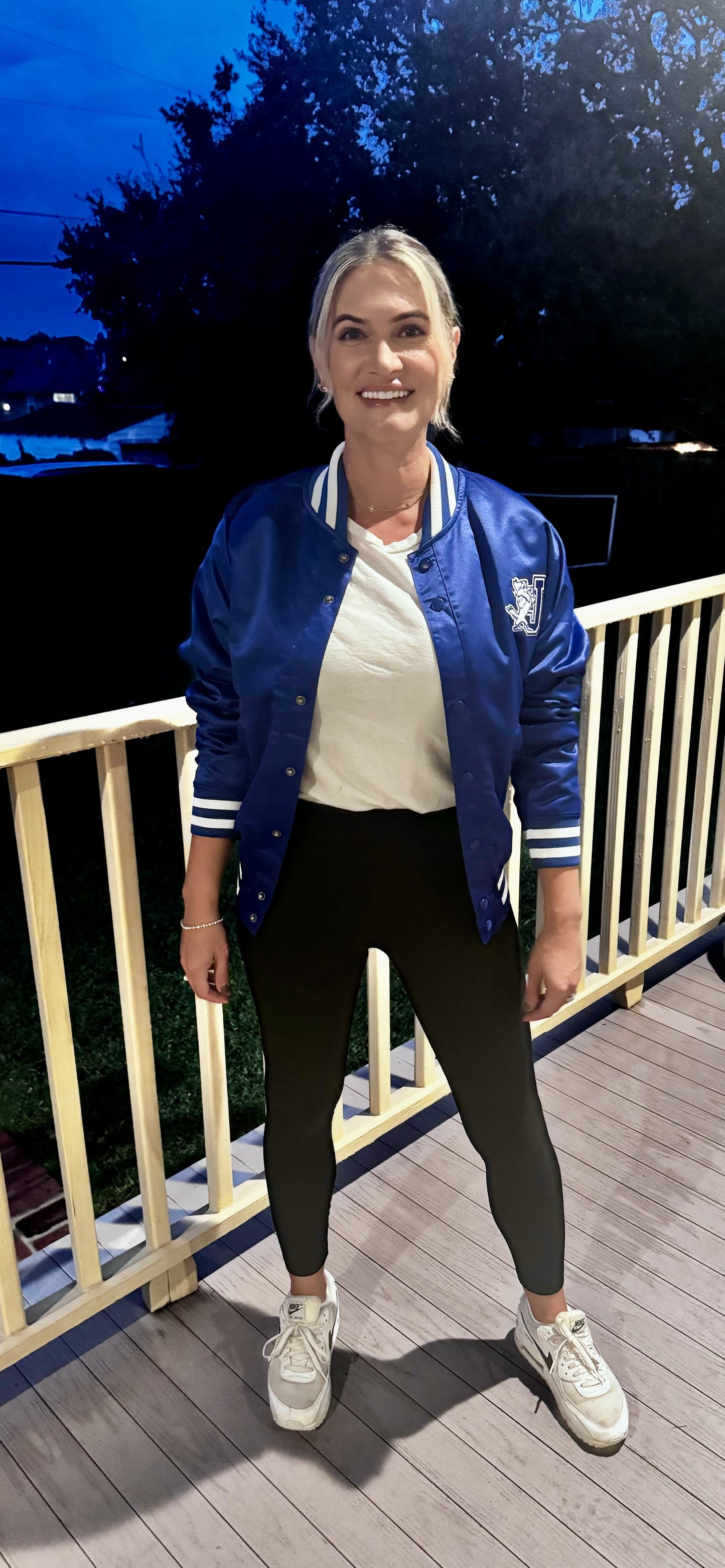 Champion.
100% Polyester Satin.
This Satin Bomber Jacket is a modern twist on the vintage varsity style. The jacket features a striped stand-up collar, cuffs and waistband. Jayson/J logo at left chest, and JESUIT displayed on the jacket's backside. Quilted lining. Wear it when you want to show off your Blue Jay spirit! Thank you for modeling Laura Tucker!