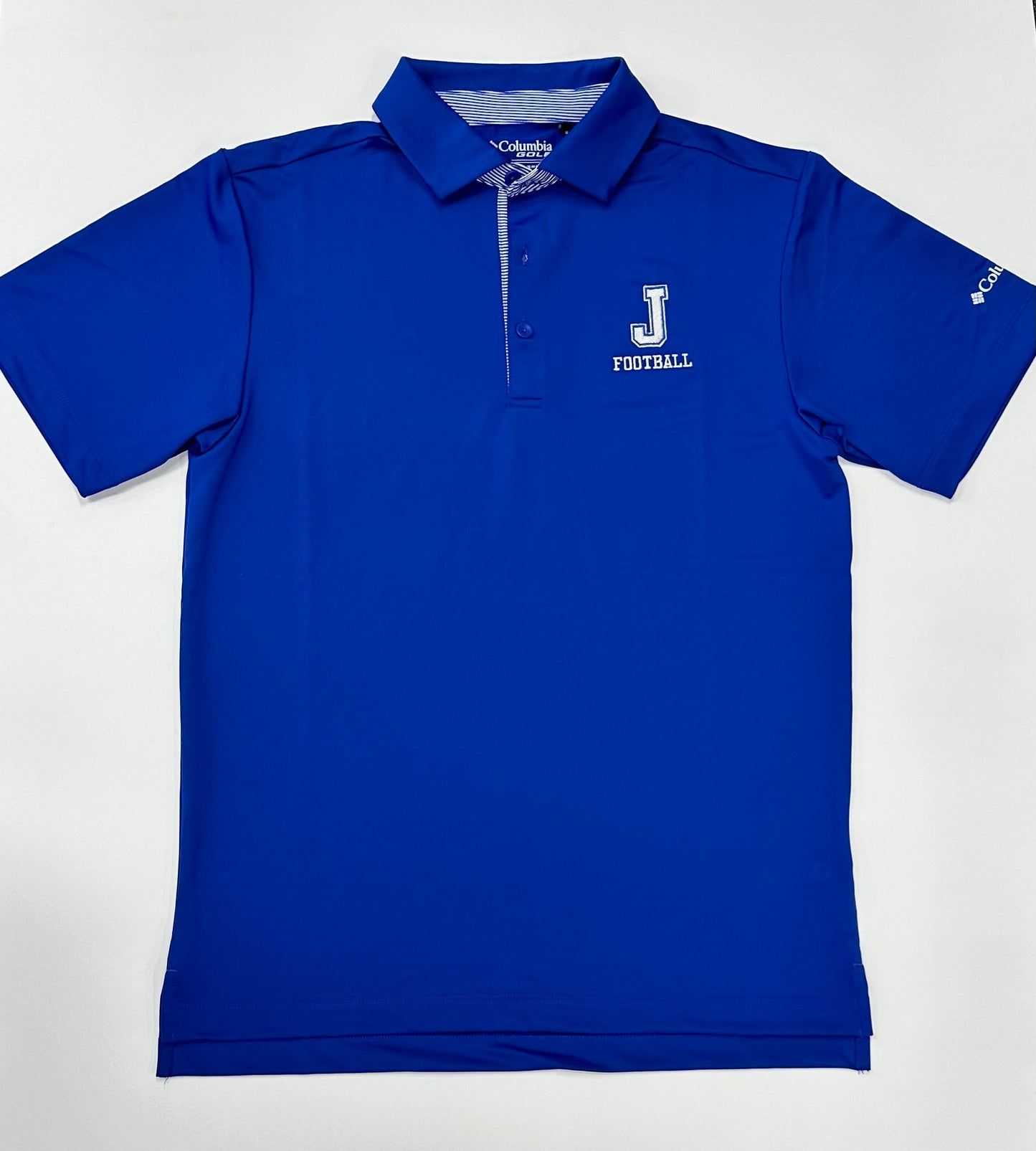 Columbia. 88% Polyester/12% Lycra. Omni-Shade UPF 30 sun protection. Self-fabric collar with sewn in collar stays. Collar stand. J Football embroidered logo.