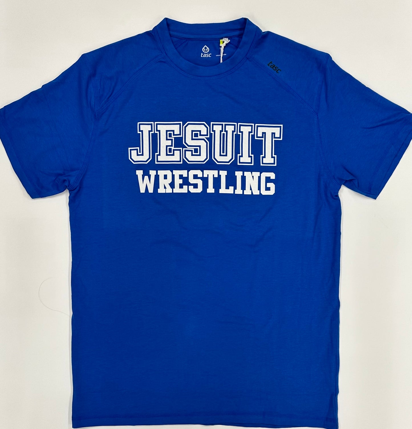 Tasc Performance.
The shirt that started this New Orleans brand!
Lightweight performance fabric for year-round comfort, modified raglan shoulder, 30" length.
52% Organic Cotton/43% Viscose from Bamboo/5% Lycra Spandex.
Jesuit WRESTLING logo.