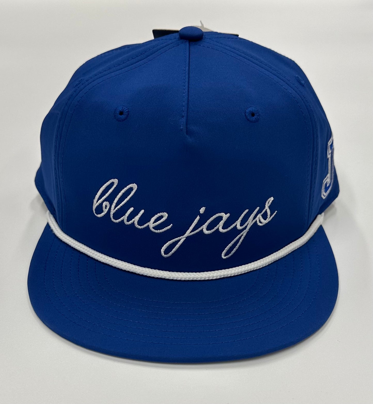The Game.
97% Polyester/3% Spandex. One size fits most.
Flat bill baseball hat with performance 5-Panel gamechanger. Snapback with rope detail.
Blue Jays cursive logo with J logo on side.