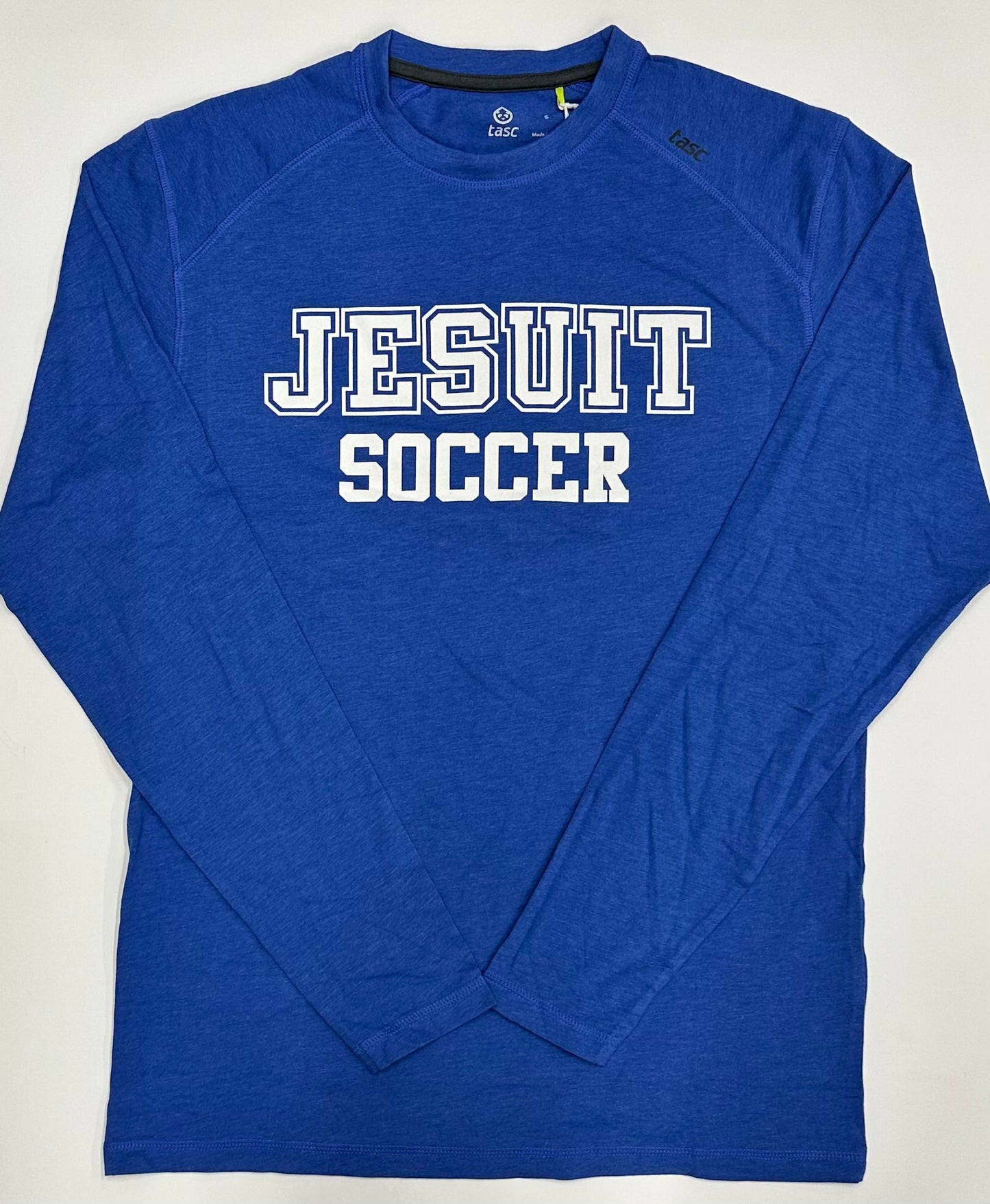 Tasc Performance.
Lightweight performance fabric for year-round comfort, modified raglan shoulder, 30" length.
52% Organic Cotton/43% Viscose from Bamboo/5% Lycra Spandex.
Jesuit SOCCER logo.