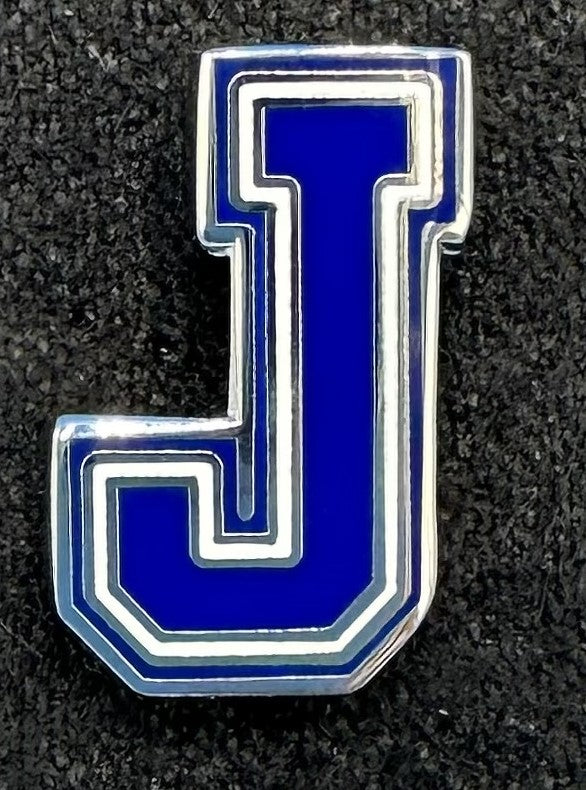 Plated base metal with enamel.  Measures .75" height.