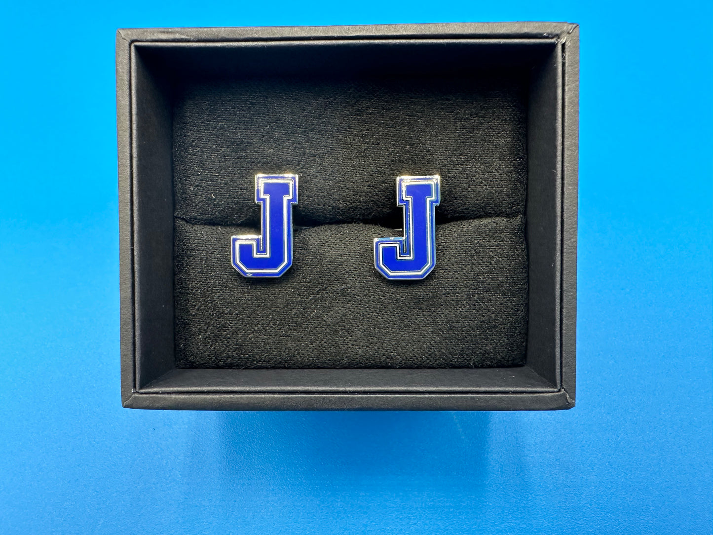 7/8" x 3/4". Plated base metal with enamel. Bullet backed closure.