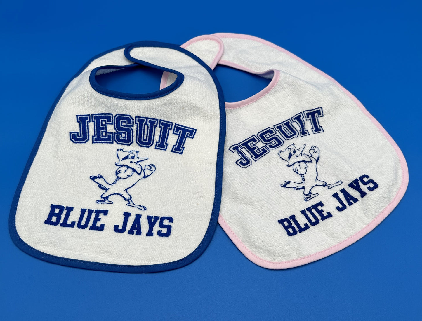 Rabbit Skins. 100% Cotton w/back neck closure. Available with Blue or Pink trim!