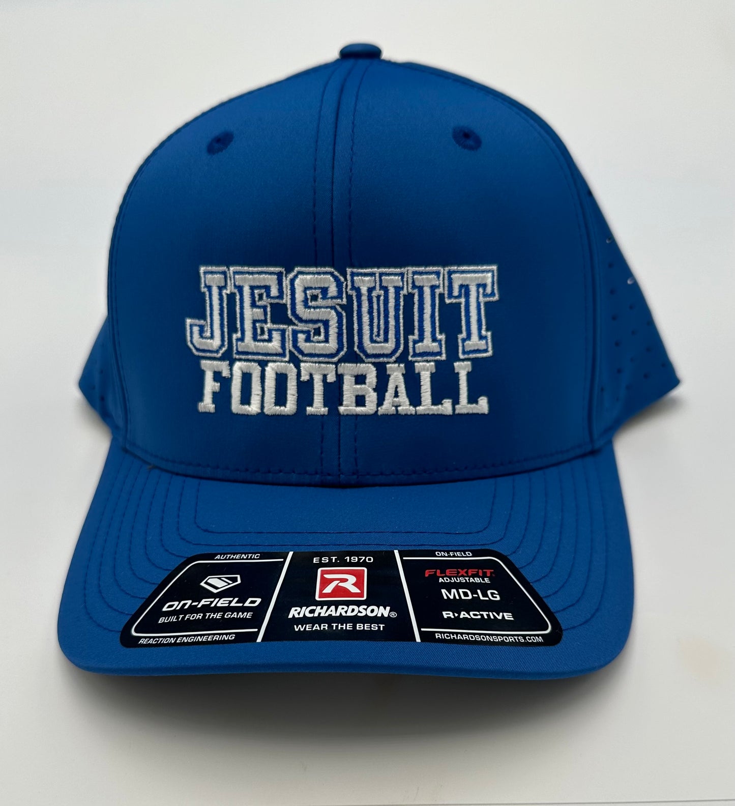 Richardson. 98% Polyester/2 % Spandex. The 632 style is a performance take on their classic six-panel, Mid Pro baseball cap. Laser-perforated panels allow for optimal airflow. R-Flex technology stretches for simpler sizing and an ideal fit. Stay-Dri sweatband wicks moisture for game-long comfort and an optimal fit. Size: MD-LG (7 1/8 - 7 3/4) Jesuit FOOTBALL embroidered logo.