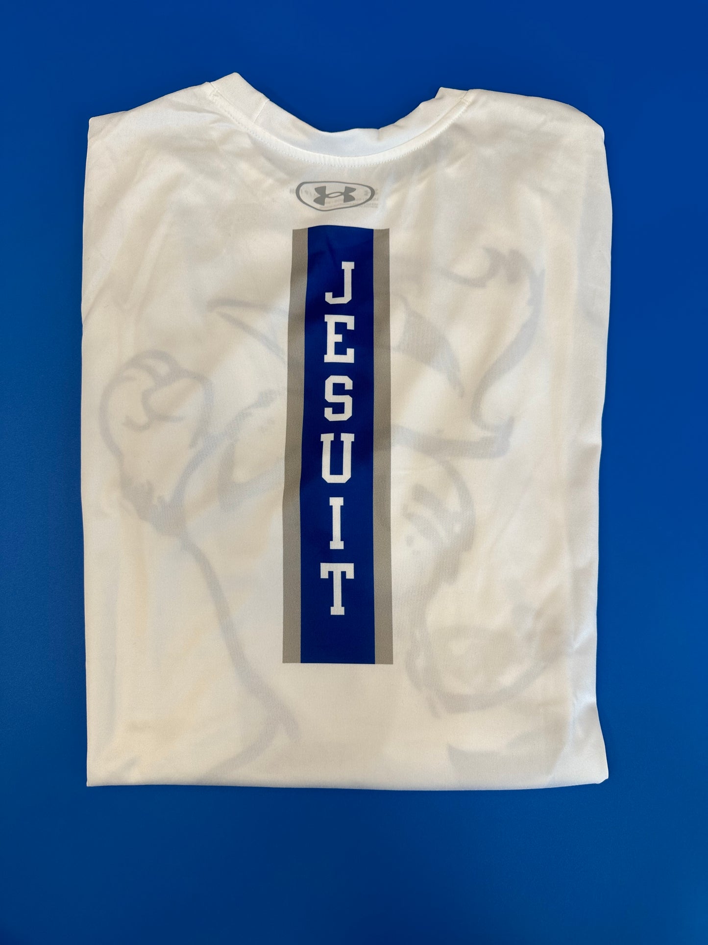 Under Armour. 100% Polyester. Performance Fabric. Jayson on Front w/JESUIT down center back.