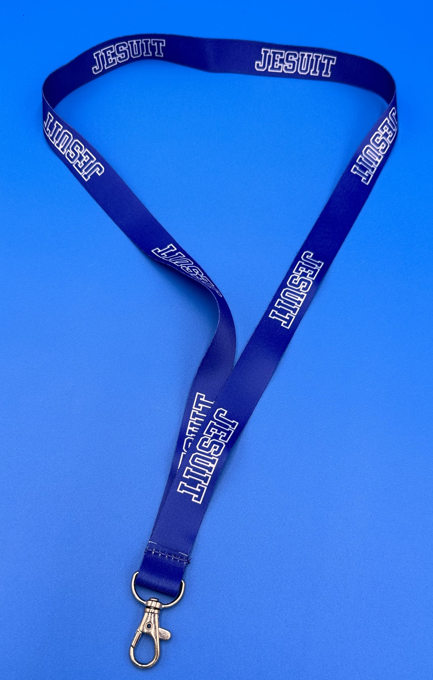 Polyester Jesuit ribbon w/clip attachment for holding I.D. and/or keys. Measures 35".