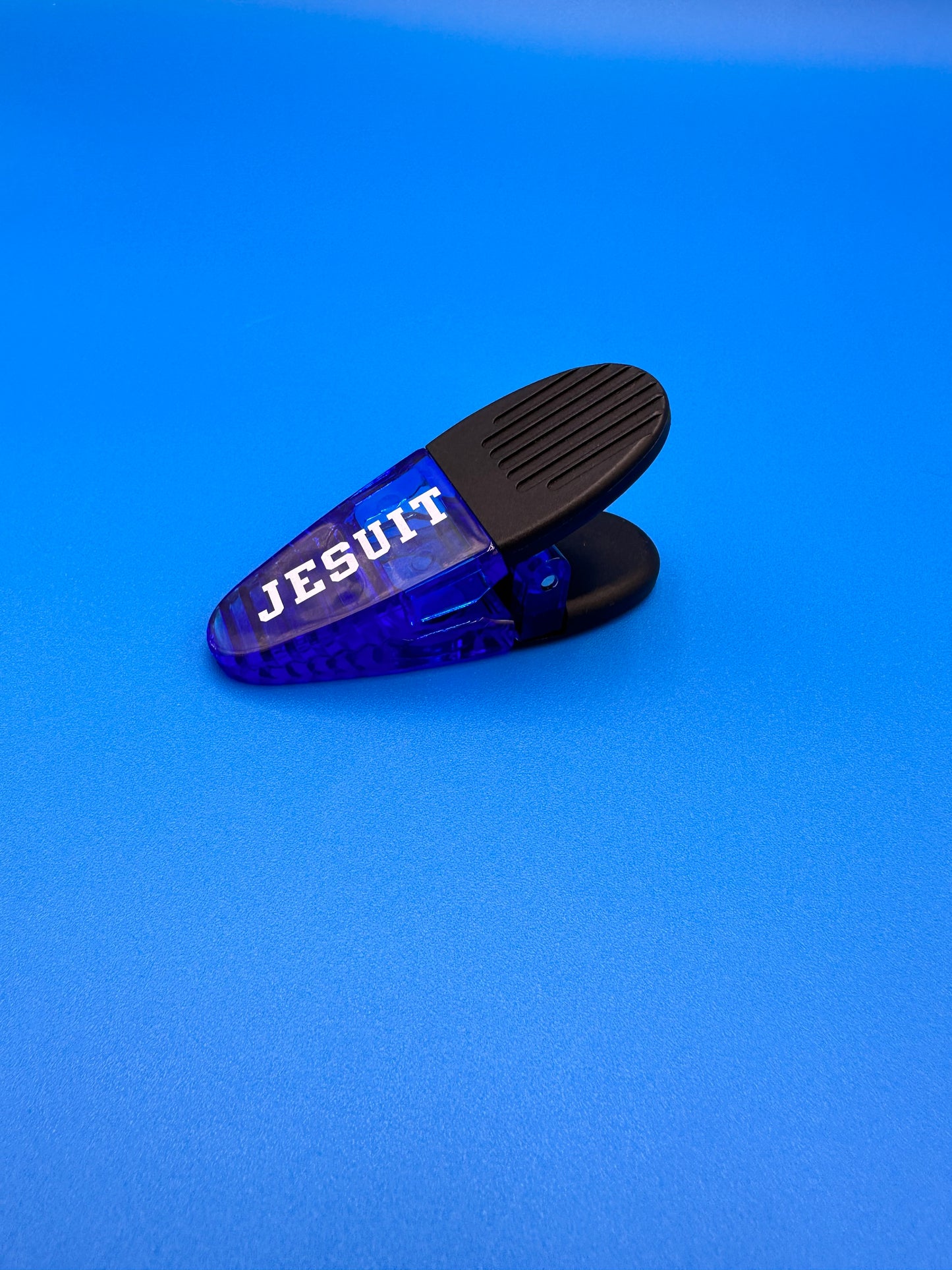 Jesuit Magnetic Clip. Great for clipping foods to stay fresh OR holding papers on your refrigerator!