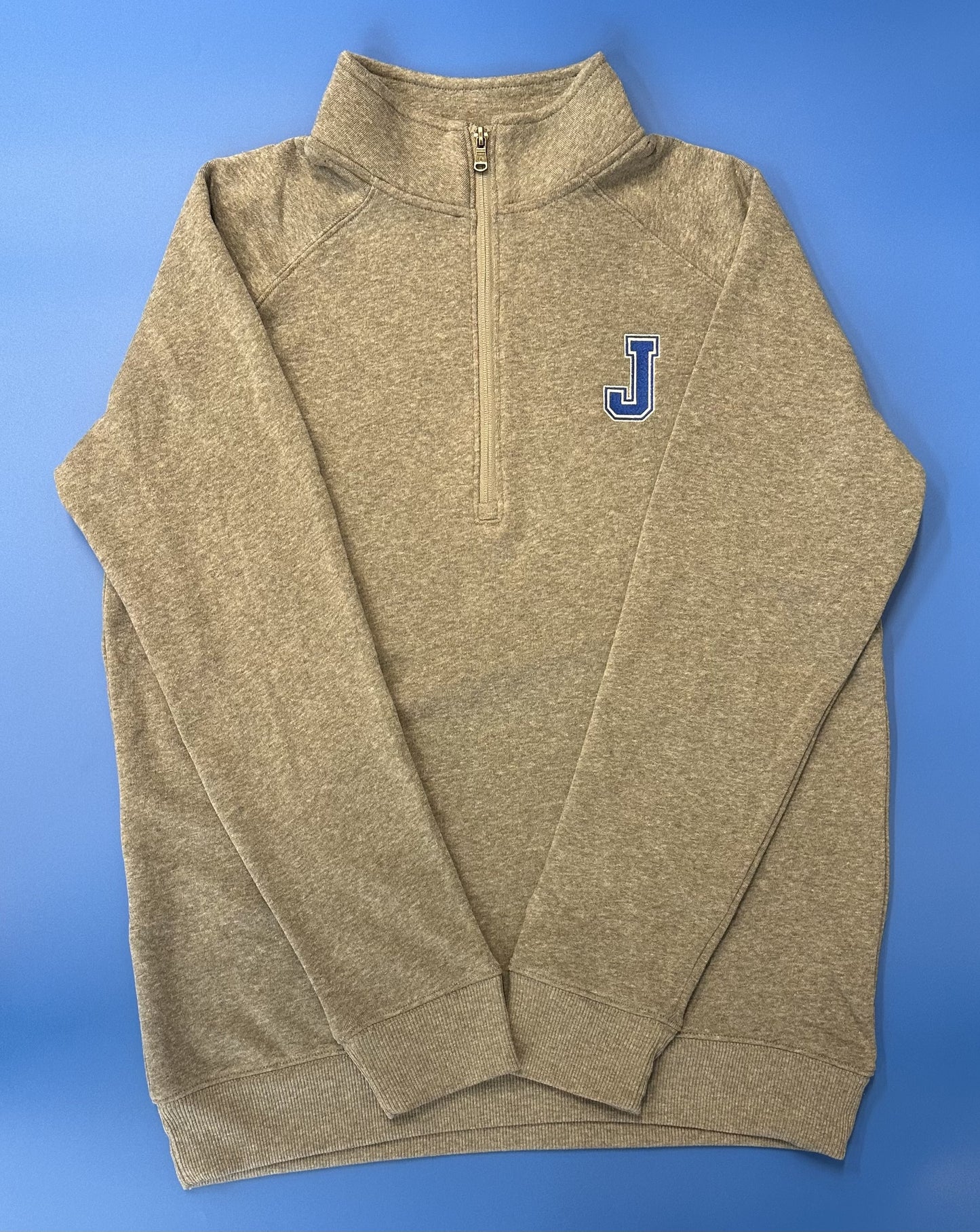 Champion. 47% polyester/39% cotton/14% rayon triblend fleece Classic raglan silhouette with stand collar. Color matched reverse coil zipper at center front. 2 x 2 rib at cuffs & waistband. Embroidered J logo.