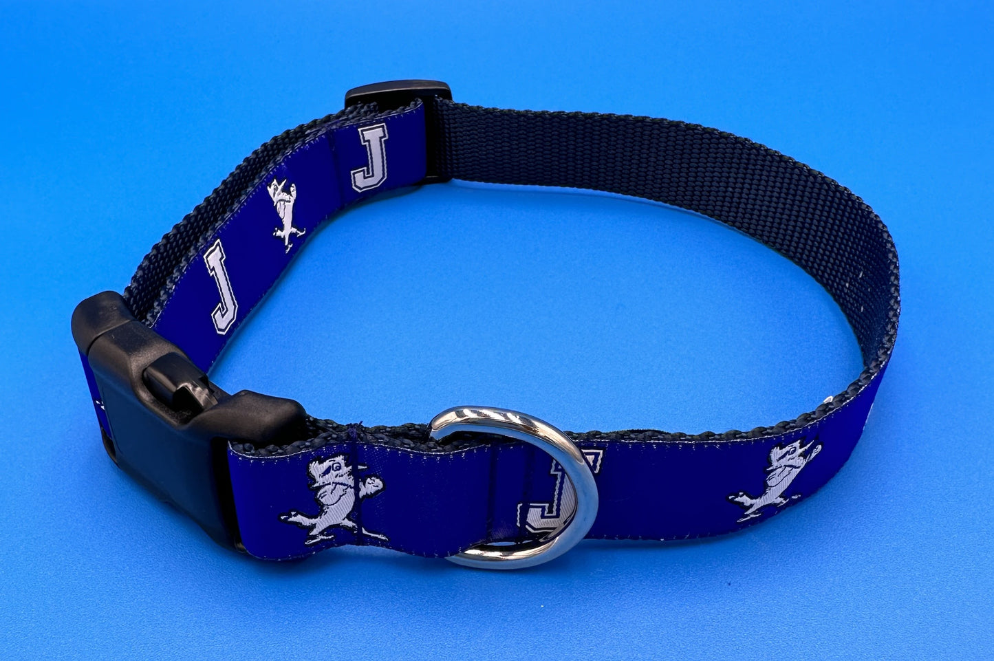 NOLA Couture. Adjustable Sizes. Woven J w/Jayson Ribbon on durable Nylon Webbing. Silver Nickel & Plastic Hardware for attaching leash. Small fits 9"-15". Medium fits 10" to 17". Large fits 12 to 21"