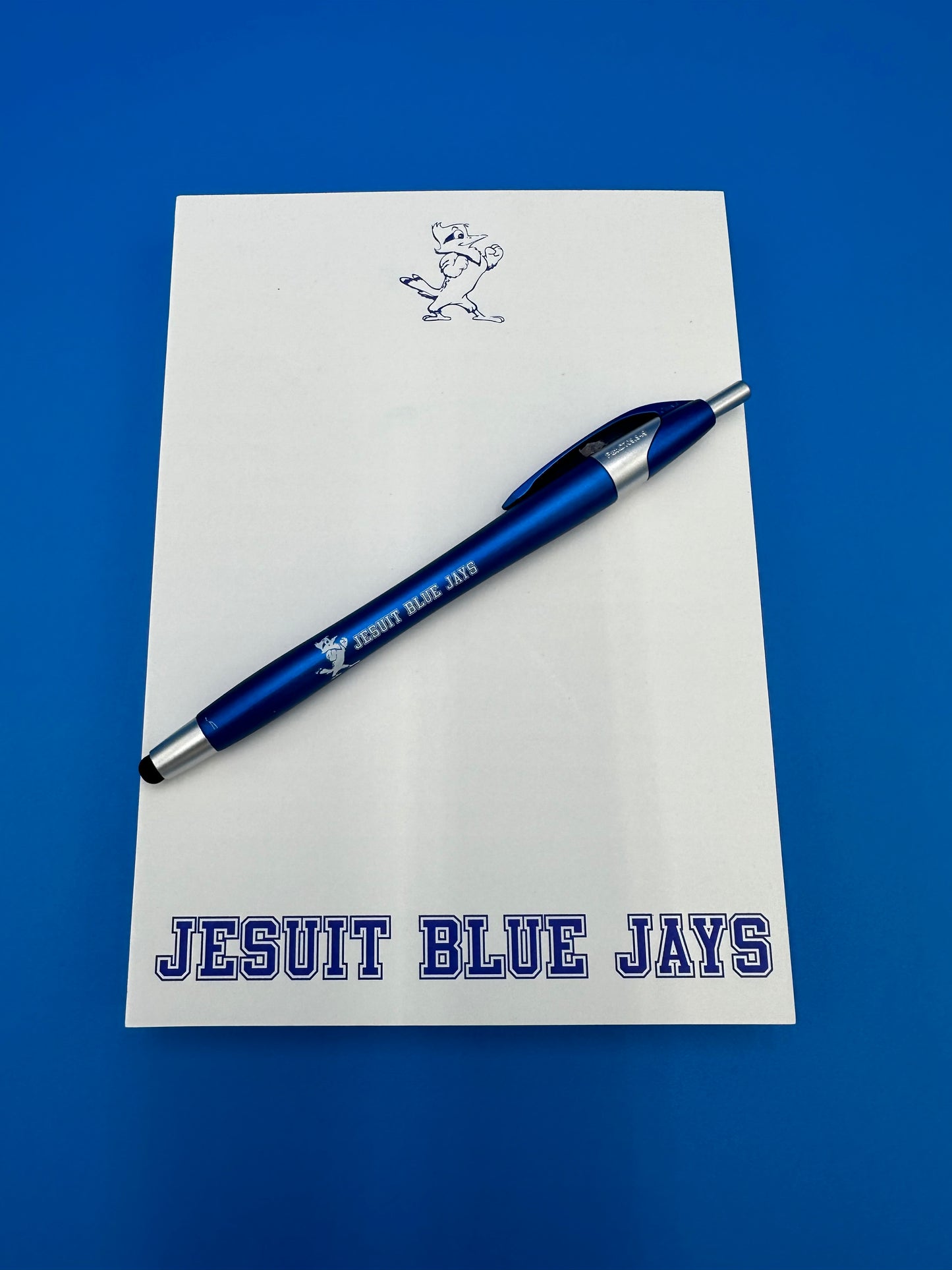 5 x 7 Note Pad with Jesuit Pen. Pad has 100 pages.