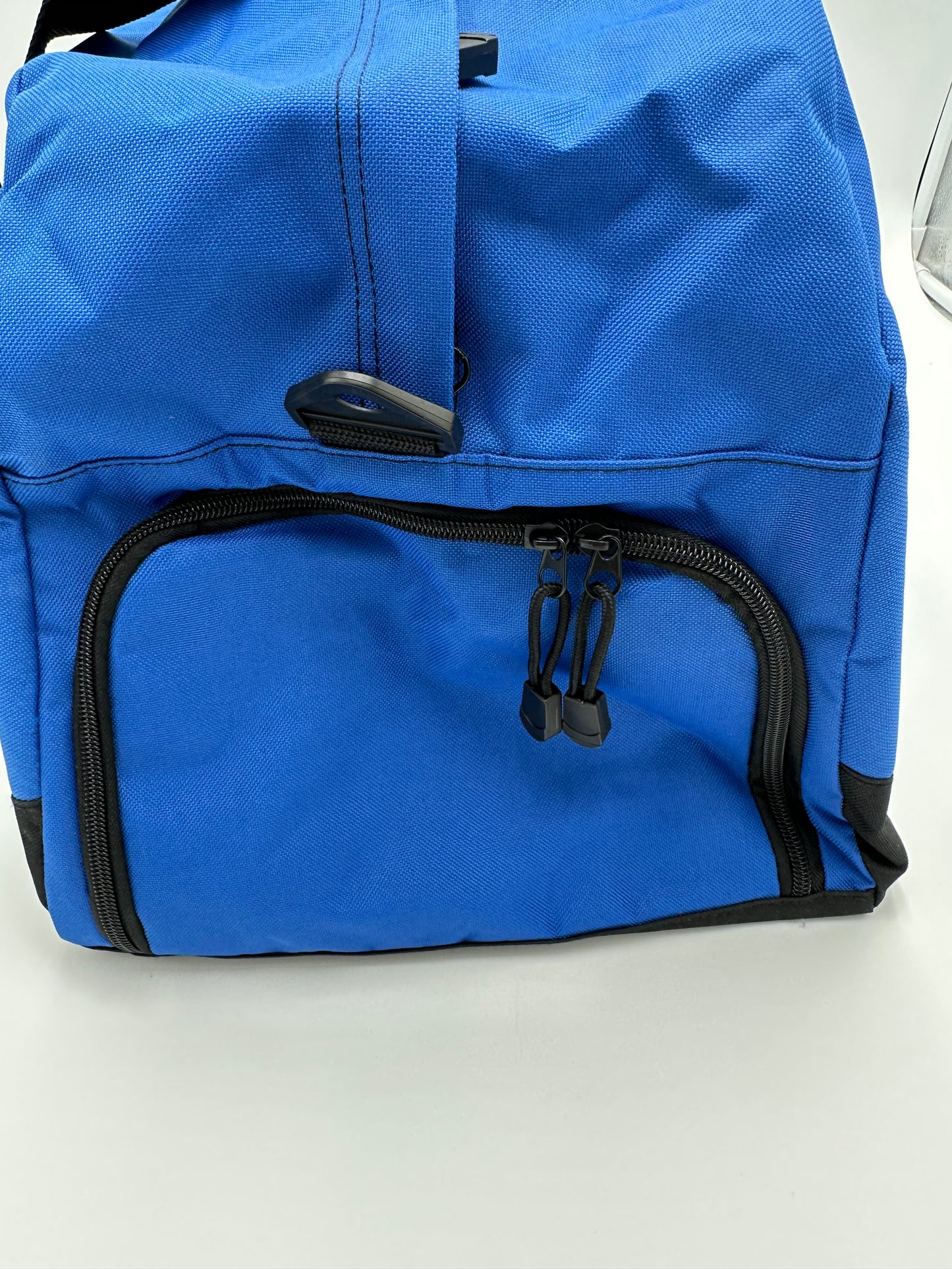 Port Authority. 600 denier polyester. Dimensions: 13"h x 23.75"w x 11.5"d. Large center opening for easy packing, interior zippered pocket, built-in bottom board for shape retention & strength.