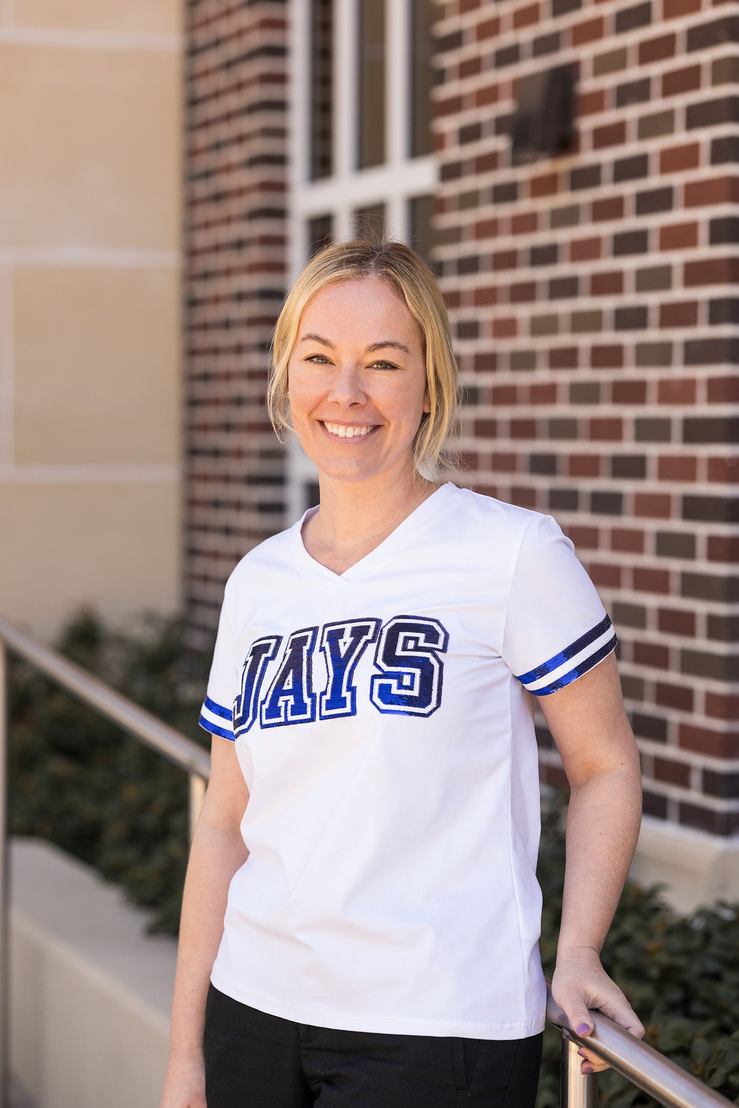 Sparkle City. 95% Cotton/5% Lycra. White tee with Royal Blue and White JAYS sequin trim as well as sequin trim on sleeves.