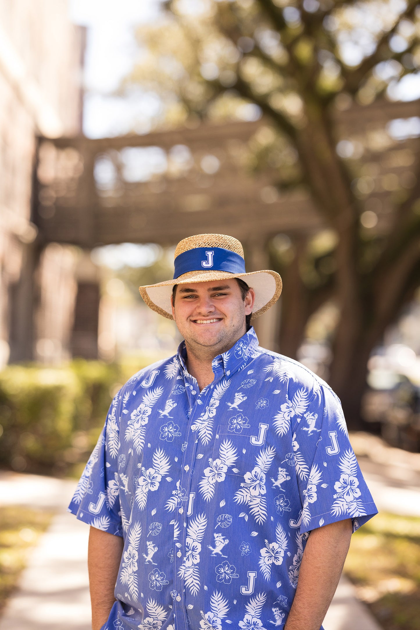 Vive La Fete. 80% Polyester/20% Cotton. Button down short sleeve shirt with a roomy fit. Classic Hawaiian print in Royal Blue and White with the J and Jayson logos!