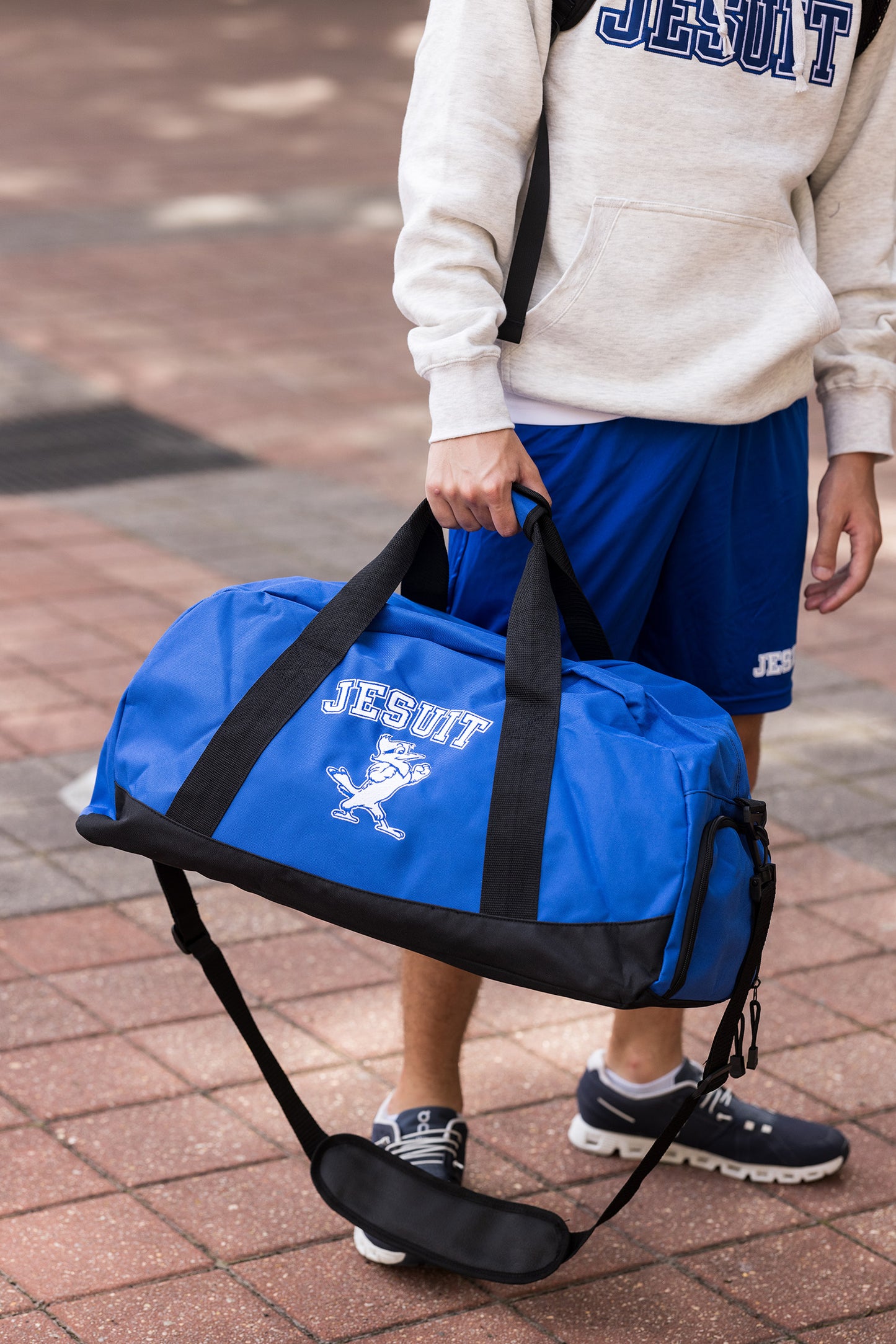 Port Authority. 600 denier polyester. Dimensions: 13"h x 23.75"w x 11.5"d. Large center opening for easy packing, interior zippered pocket, built-in bottom board for shape retention & strength.