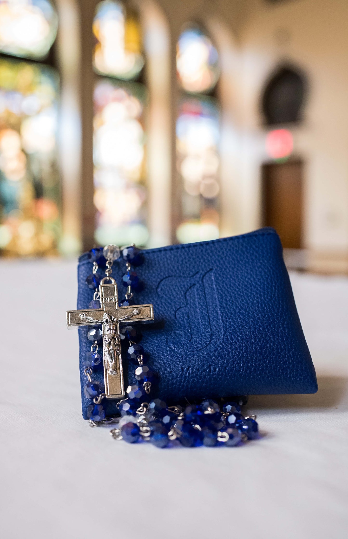 Each rosary comes with a royal blue leatherette zippered pouch embossed with an English Jesuit J and A.M.D.G.
Store rosaries in an airtight bag when not in use to preserve the shine of the silver plating.