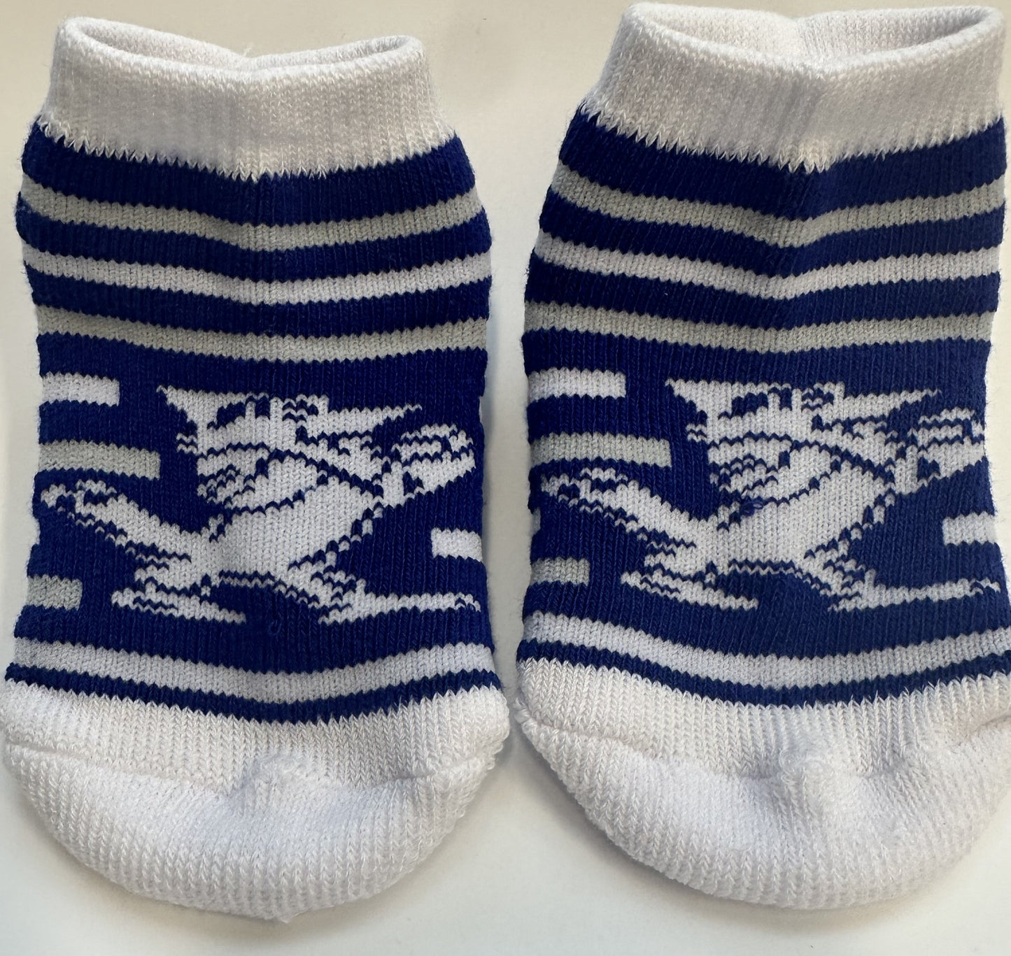TCK Sock Collection. 97% Polyester/3% Spandex. These booties have breathe-able construction, a form-fit band on top and a padded sole & toe-box. Available in 2 sizes - Infant (6-18 month) & Toddler (2-4T). Features our Fighting Blue Jay, Jayson!