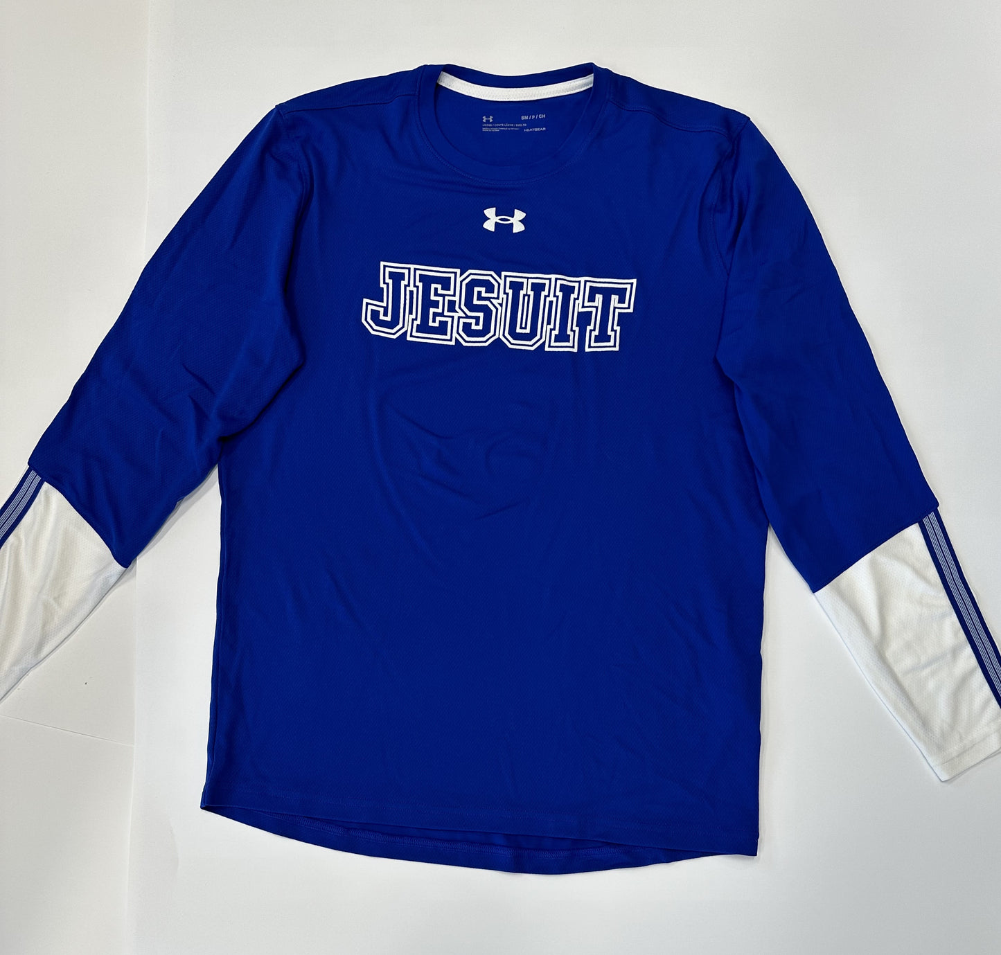 Under Armour. Performance Fabric. 100% Polyester.