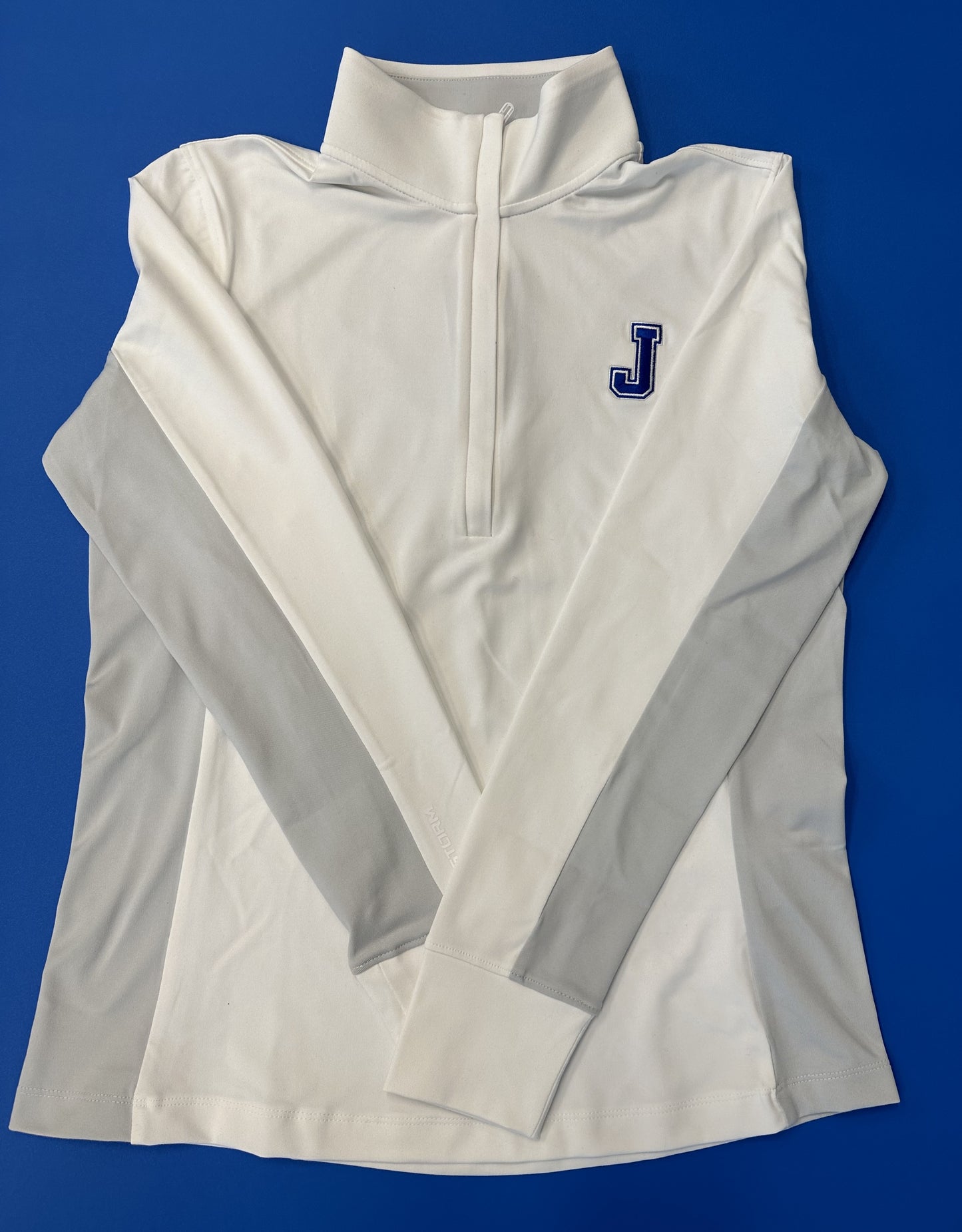 Under Armour. 88% Polyester/12% Elastane. 4-way stretch material. Streamlined fit that's not too tight or too loose. Embroidered J logo.