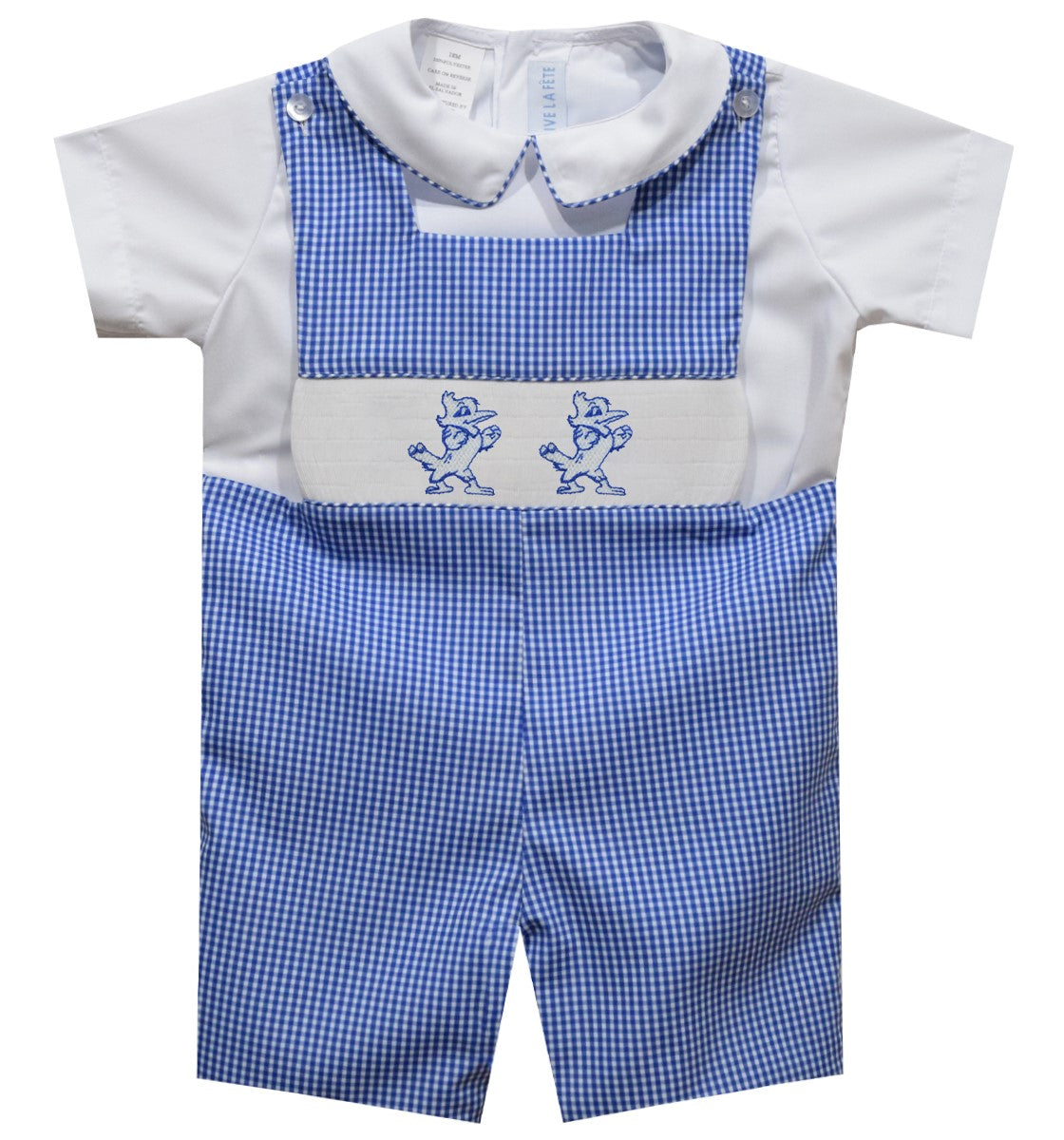 Vive La Fete. 55% Polyester/45% Cotton. Button shoulder shortall. Fully lined and inside leg button closure. Square neck. 100% Cotton shirt with button back closure. Piped collar. Machine Wash. Smocked Jayson Logo. This boy's classic shortall will show off his Blue Jay Spirit!