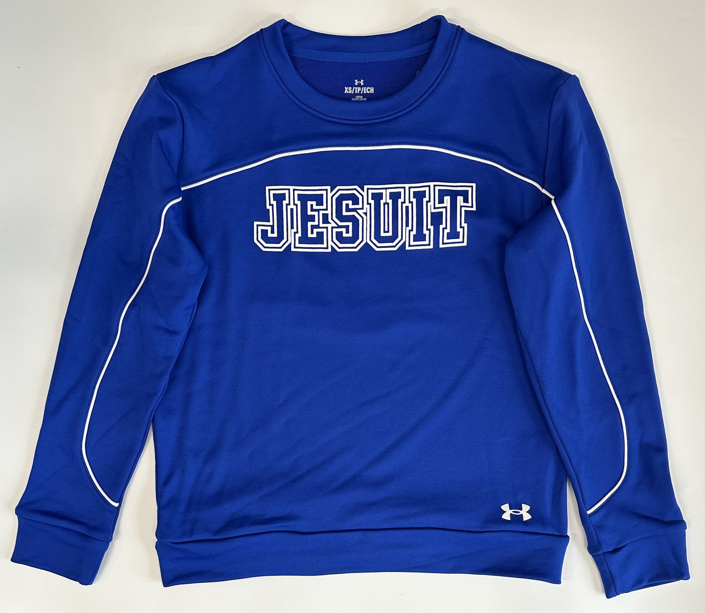 Under Armour. 100% Polyester. French terry that's stretchy, light and dries really fast. Has white piping detail. Relaxed fit and modern, shorter length.