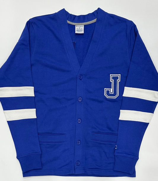 Champion.

60% Cotton/40% Polyester french terry fabric.

This retro 1950's cardigan sweater features two white stripes on the sleeves with the J logo on left chest. V-neck, button front, welt pockets. Fits well over your favorite Jesuit Game Day tee!