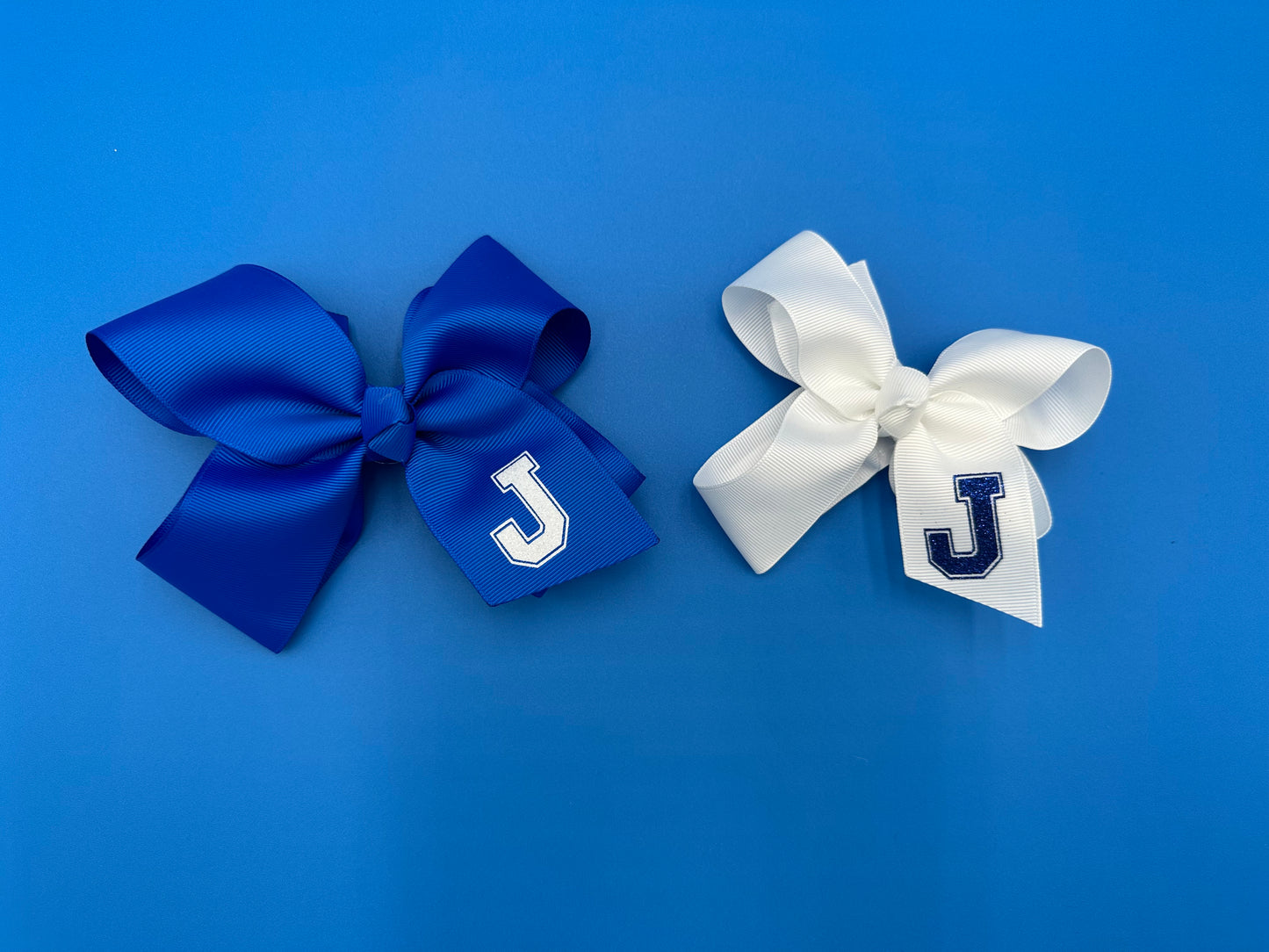 Bubble Bows available in two sizes and two colors!  Small is 4 inch wide and made with 1.5" wide ribbon.  Medium is 6 inch wide and made with 2.0" wide ribbon.  With alligator clips.  Please note:  Medium size on left/Small size on right.