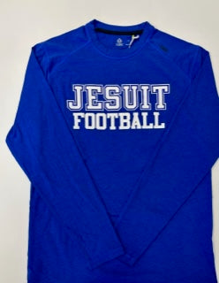 Tasc Performance.  Lightweight performance fabric for year-round comfort, modified raglan shoulder, 30" length.  52% Organic Cotton/43% Viscose from Bamboo/5% Lycra Spandex.  Jesuit Football logo.