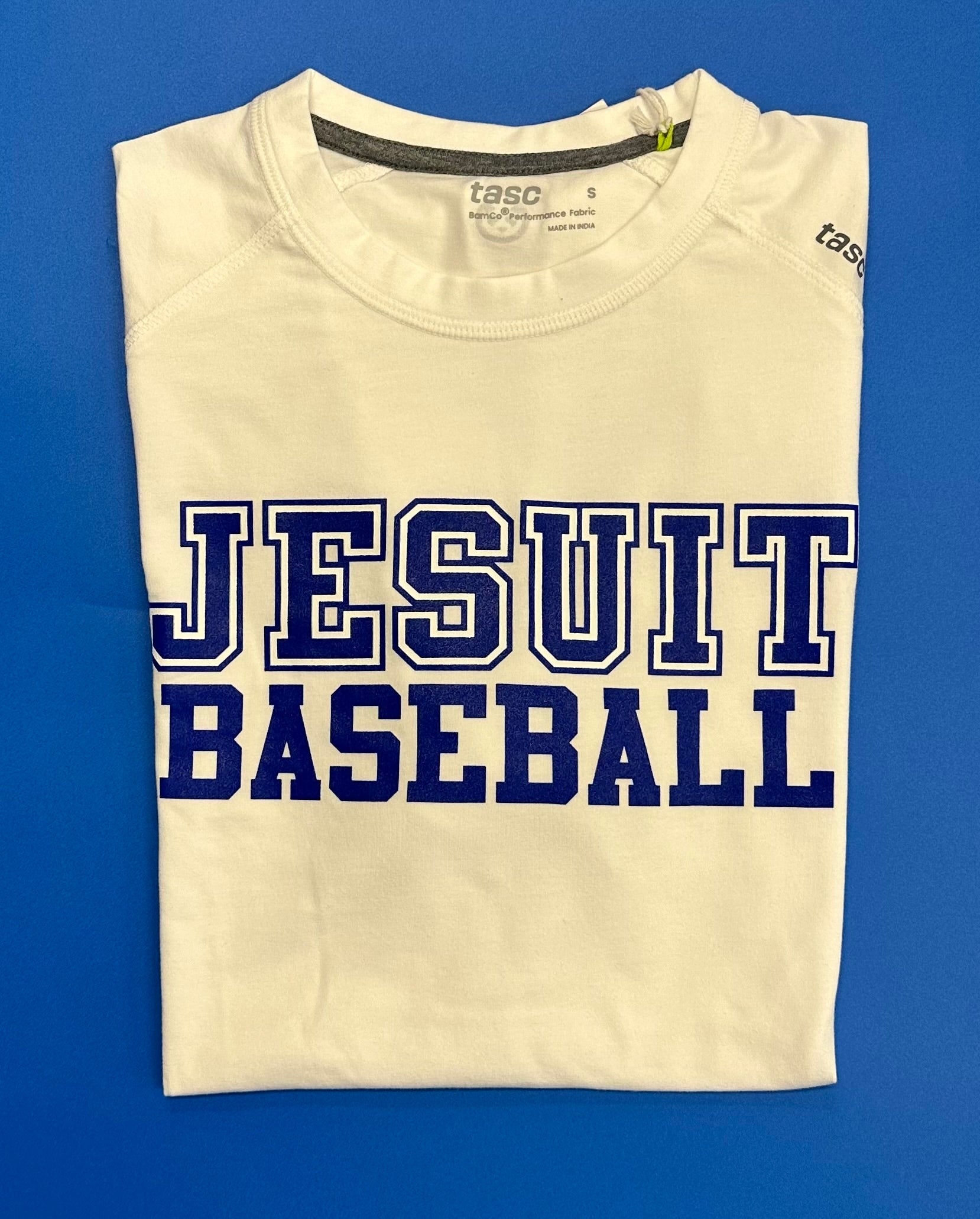 Tasc Performance.

The shirt that started this New Orleans brand!

Lightweight performance fabric for year-round comfort, modified raglan shoulder, 30" length.

52% Organic Cotton/43% Viscose from Bamboo/5% Lycra Spandex.

Jesuit BASEBALL logo.