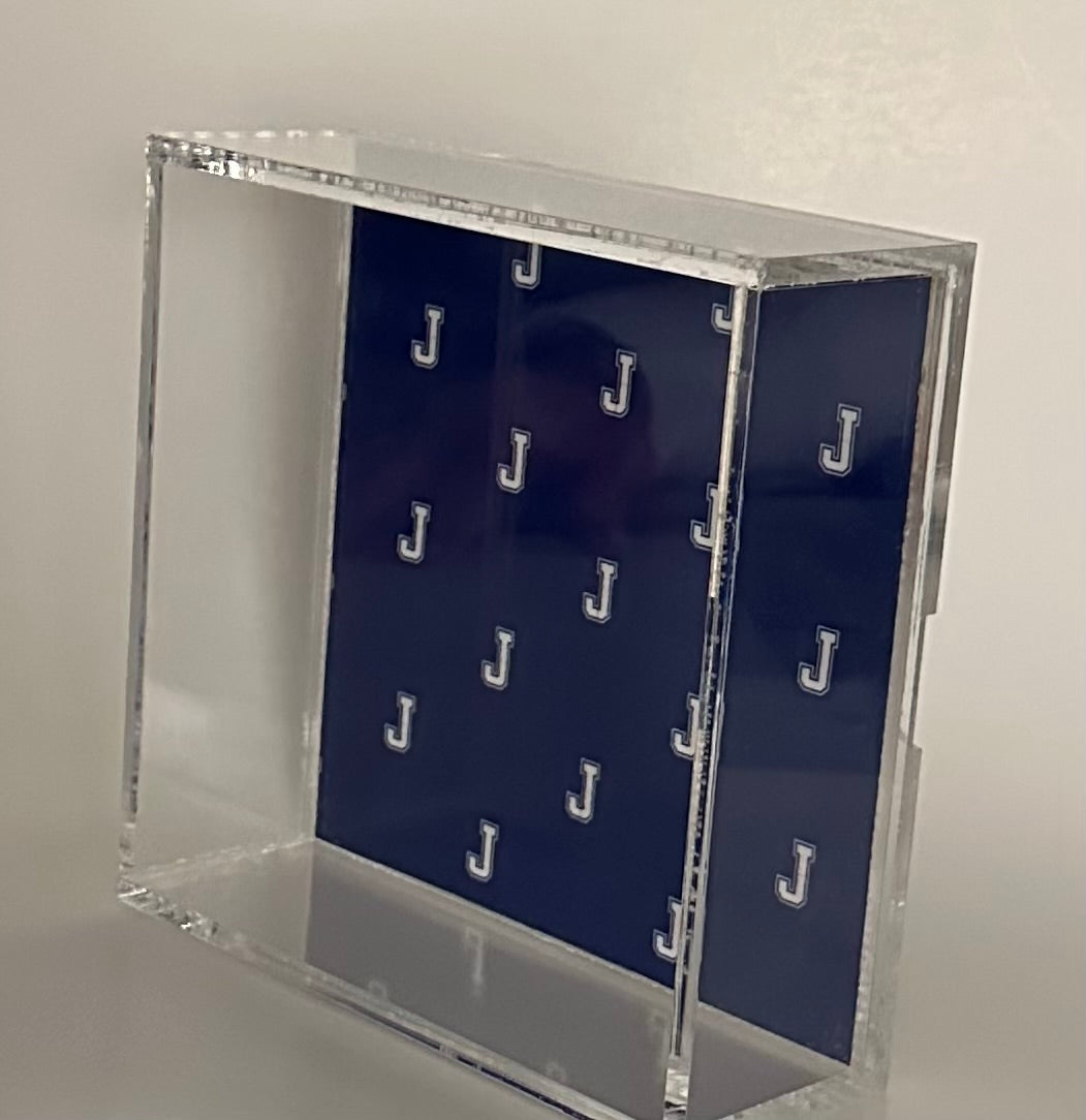 Marye-Kelley.

The possibilities are endless with this decorative tray. Perfect to use for keeping your student's must haves together and organized - Jesuit nametags, J pin, school I.D.!

The inserts slide in and out of a compartment at the bottom of the tray, are printed on both sides and are waterproof, weatherproof and tearproof.

Size: 6 x 6 square

All over J logo.