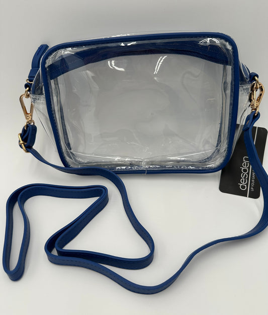 Desden.

Stadium approved. Clear bags with vegan leather trim, zipper closure and removable/adjustable strap. Jesuit straps sold separately.

Bridget measures: 8"/6"/2" Rectangle shape.
