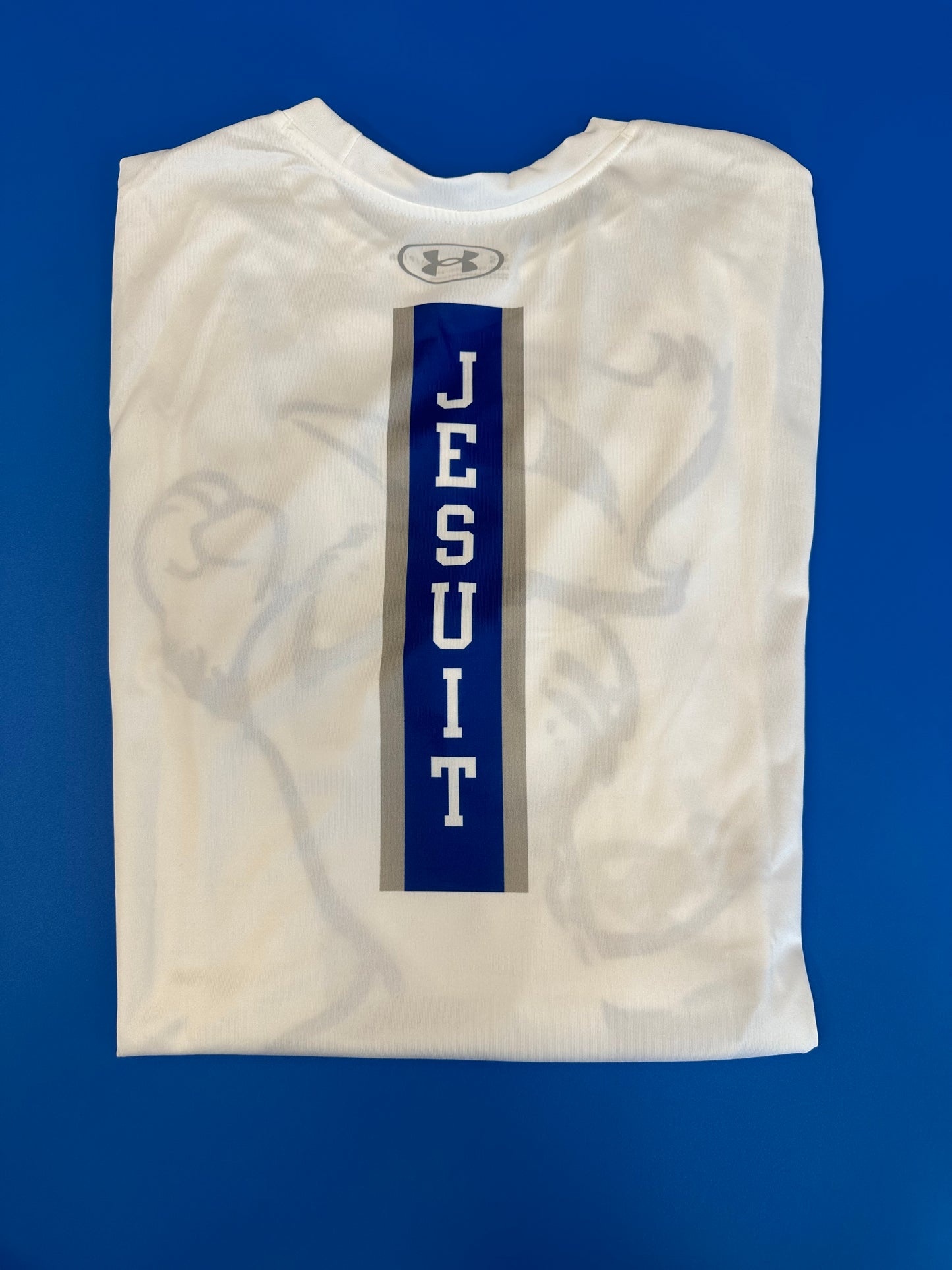Under Armour.  100% Polyester.  Performance Fabric.  Jayson on Front w/JESUIT down center back. 