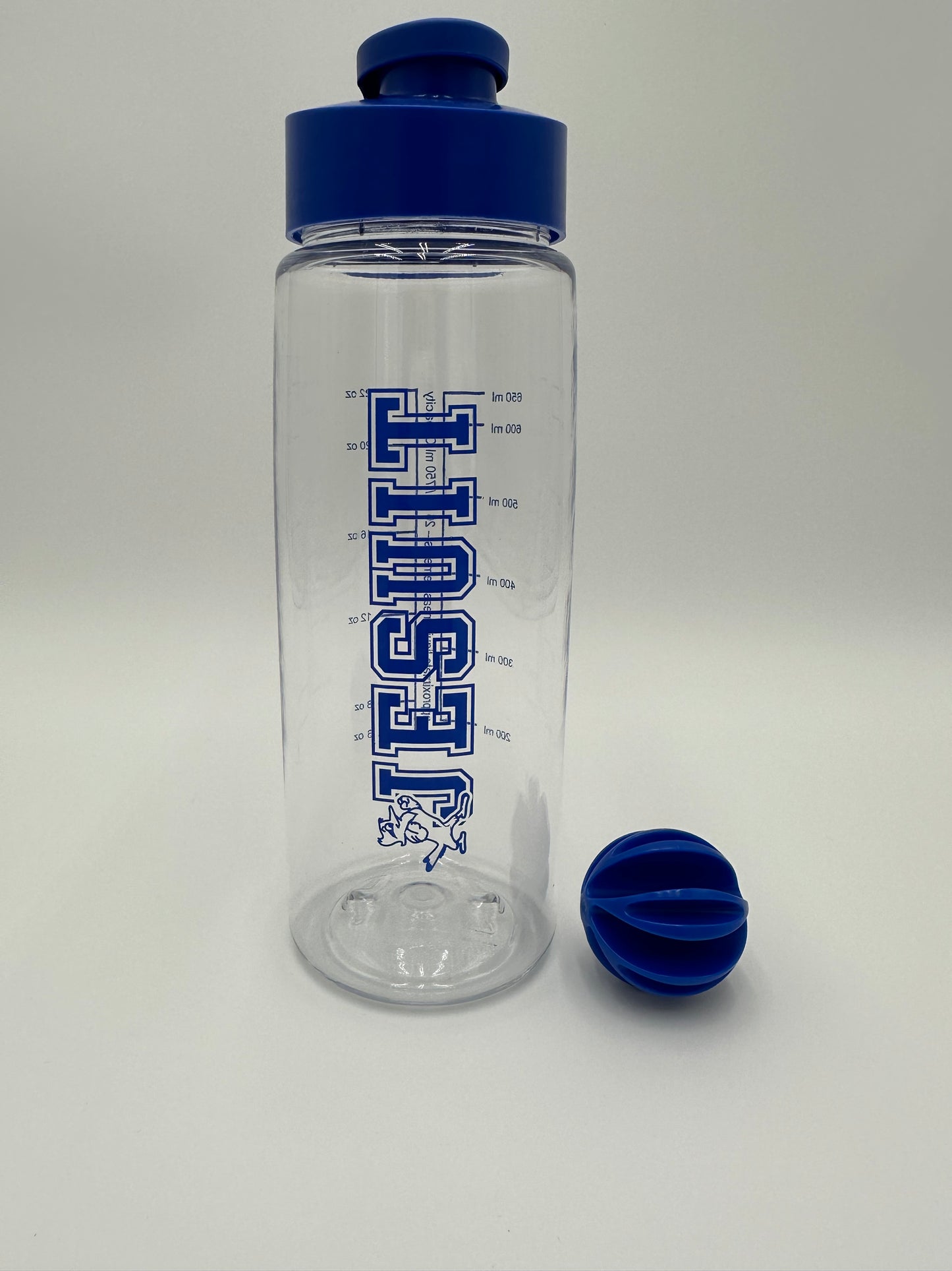 Clear Shaker/Blender bottle w/royal blue screw on lid, flip top and carry loop. Includes mixing ball.  Fluid measurements are printed on the bottle.  22 fluid oz. 