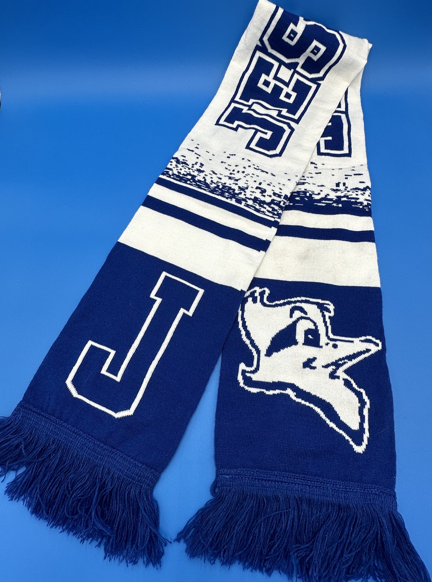 Logo Products.  100% Acrylic.  Royal Blue & White.  Measures 59" length by 8" width w/fringe.  Both sides feature Jesuit w/Jayson logo. Ideal for all Blue Jay fans wherever you're cheering!