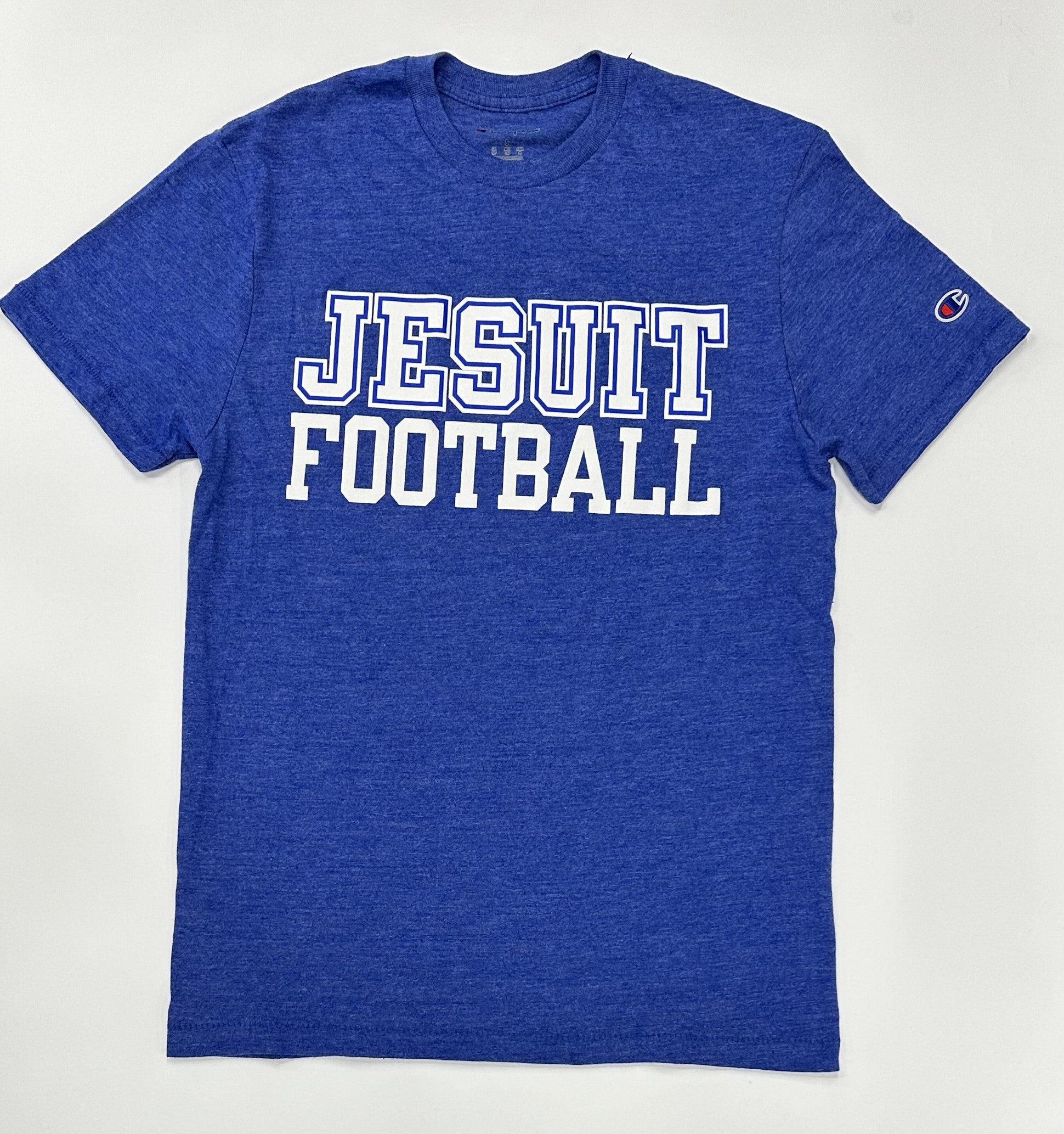 Champion.  50% Polyester/37% Cotton/13% Rayon Jersey.  1 x 1 rib at collar.  Set in short sleeve with slightly shorter, more modern fit.  Jesuit FOOTBALL logo.