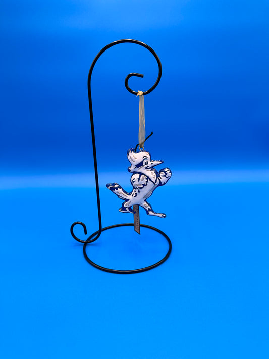 Kitty Keller Designs.  Display your keepsake Jesuit ornaments year round with this all season display!   Single Hanger ornament display stand. Smooth Wire construction with glossy black finish. Stand is 11-1/2"H & holds items up to 8"L x 5" diameter. Base is 5-3/8" diameter.  Ornament sold separately!   
