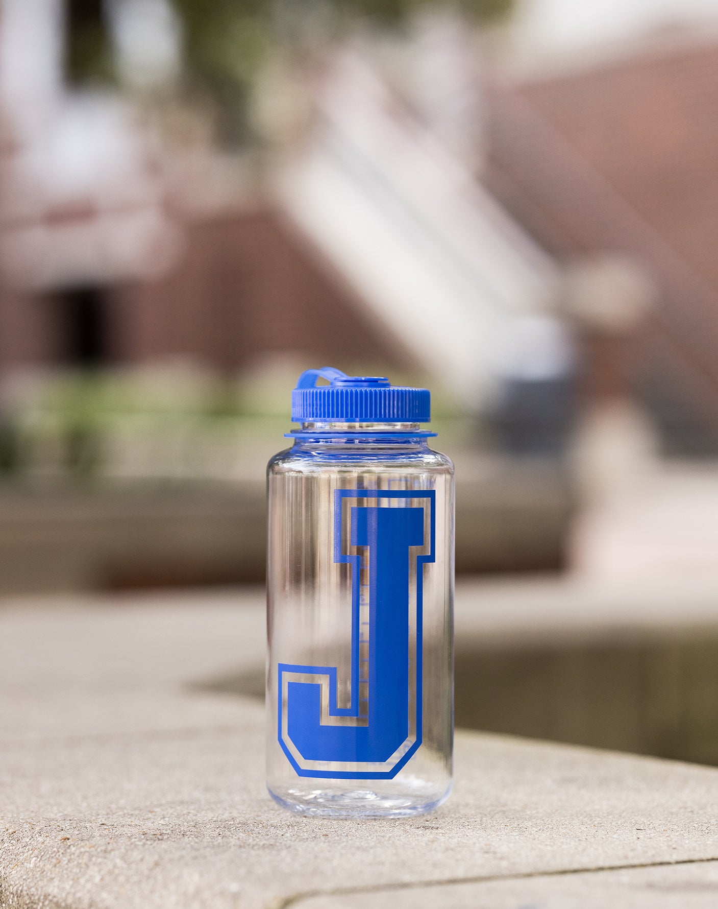 Nalgene. 32 oz. with fluid measurements on one side. J Logo. Clear bottle with wide mouth. BPA/BPS free.