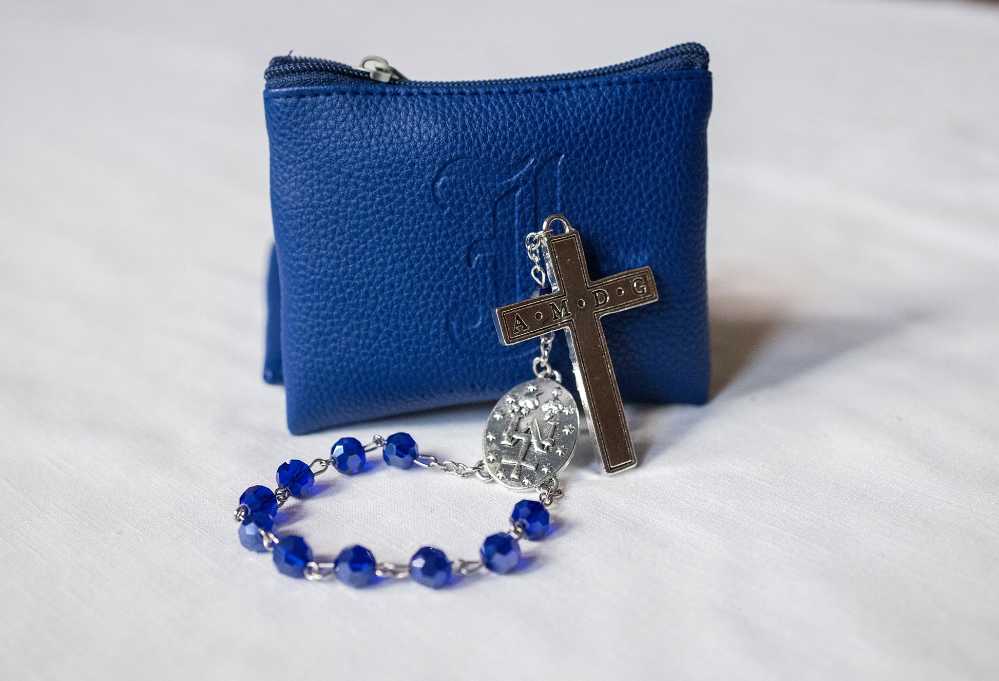 The pocket-sized rosary measures 7.5” from the top of the bead to the bottom of the crucifix.