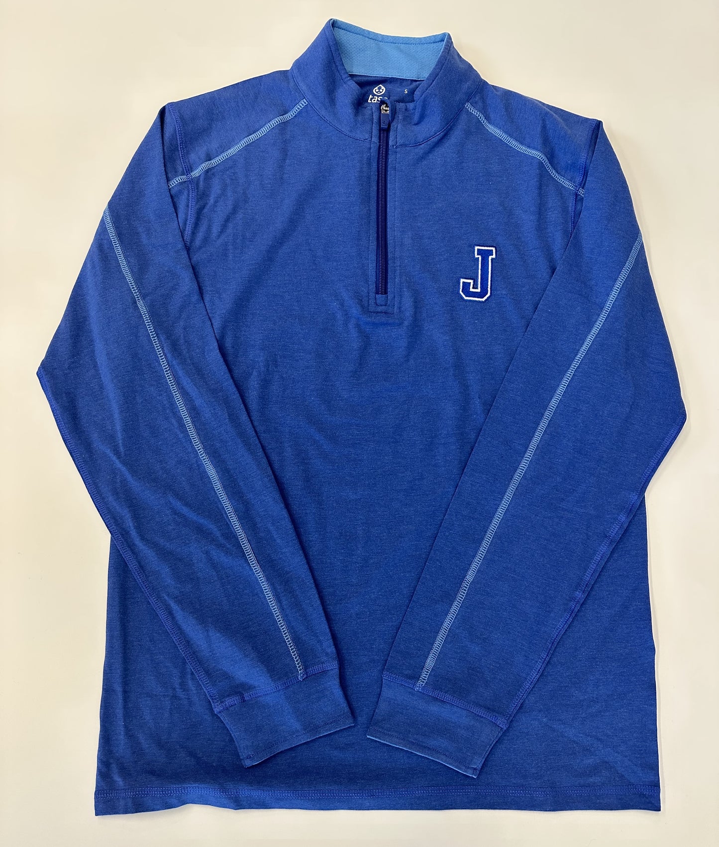 Tasc Performance.  51% Organic Cotton/41% Viscose from Bamboo/8% Lycra Spandex.  Lock down zipper with garage, contrast seaming, sleeve cuffs, 30" length.  Embroidered J logo.
