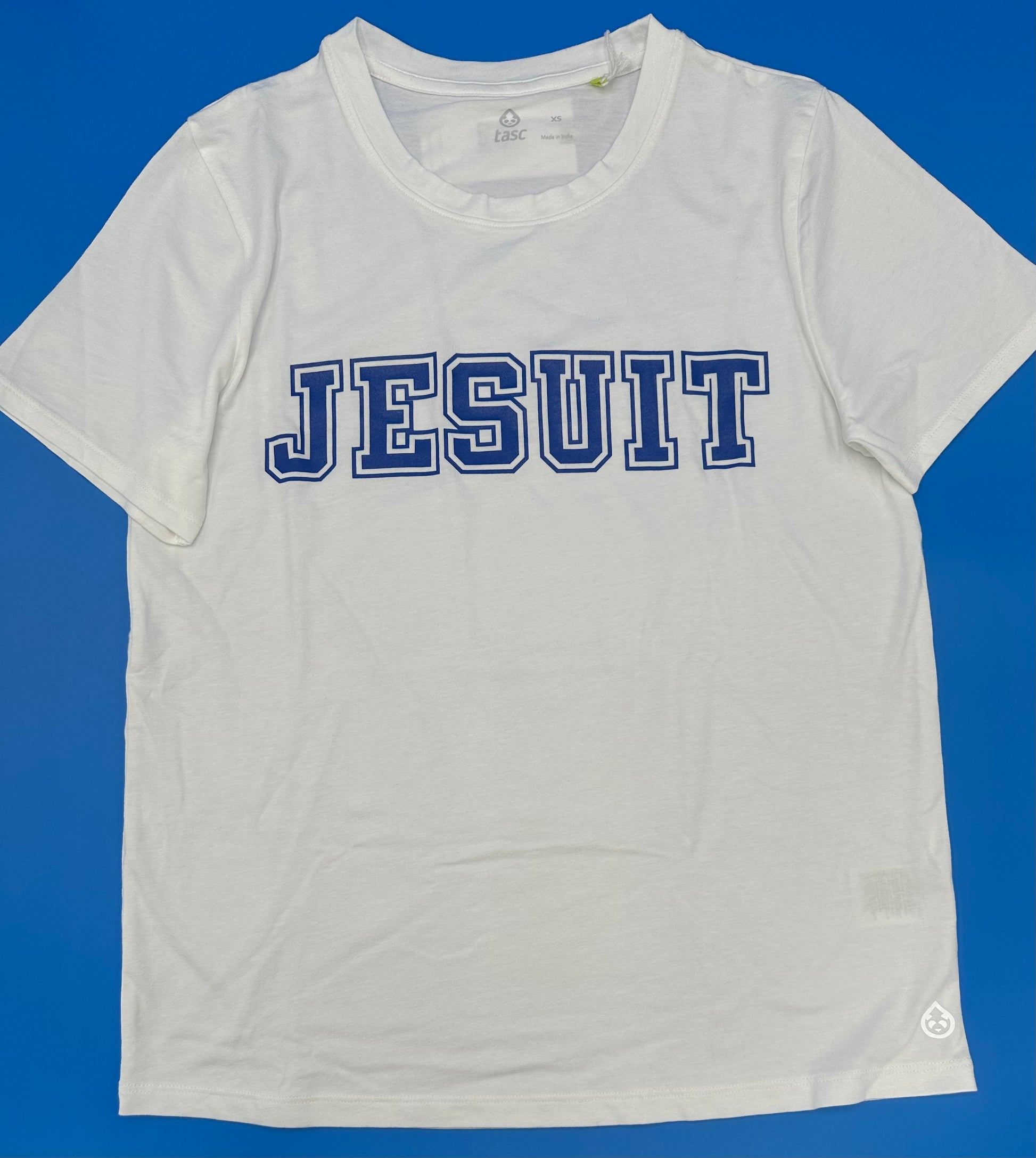 Tasc Performance.  52% Cotton/43% Viscose from Bamboo/5% Lycra.  Self-collar with scalloped bottom hem. Approximately 24.5 inches body length.  Machine washable/Tumble dry low. Made with lightweight, breathable, moisture-wicking bamboo fabrication.  Jesuit screenprint logo.