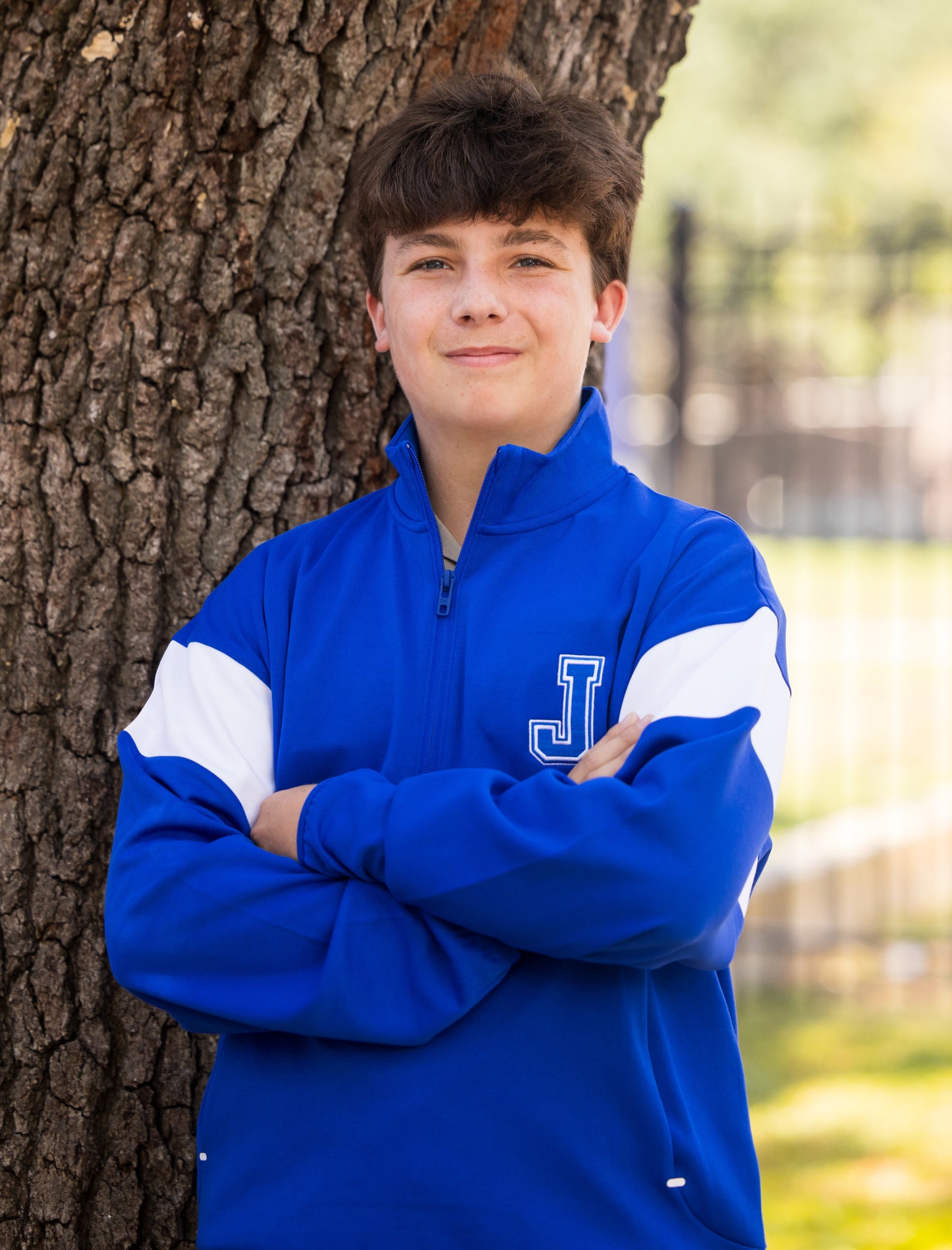 Under Armour.

60% Cotton/40% Polyester.

Double-knit fabric is soft, stretchy &amp; breathable for superior comfort &amp; mobility. Dropped shoulder. Open hand pockets. Royal blue with white stripe contrast on sleeves. Ribbed cuffs and hem.

Embroidered J logo.