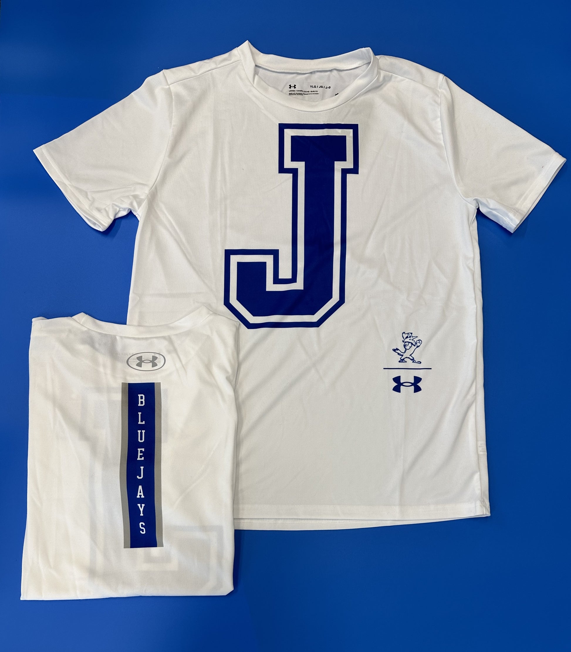 Under Armour.  100% Polyester  Performance Fabric.  Big 'J' on the front w/BLUE JAYS down center back.
